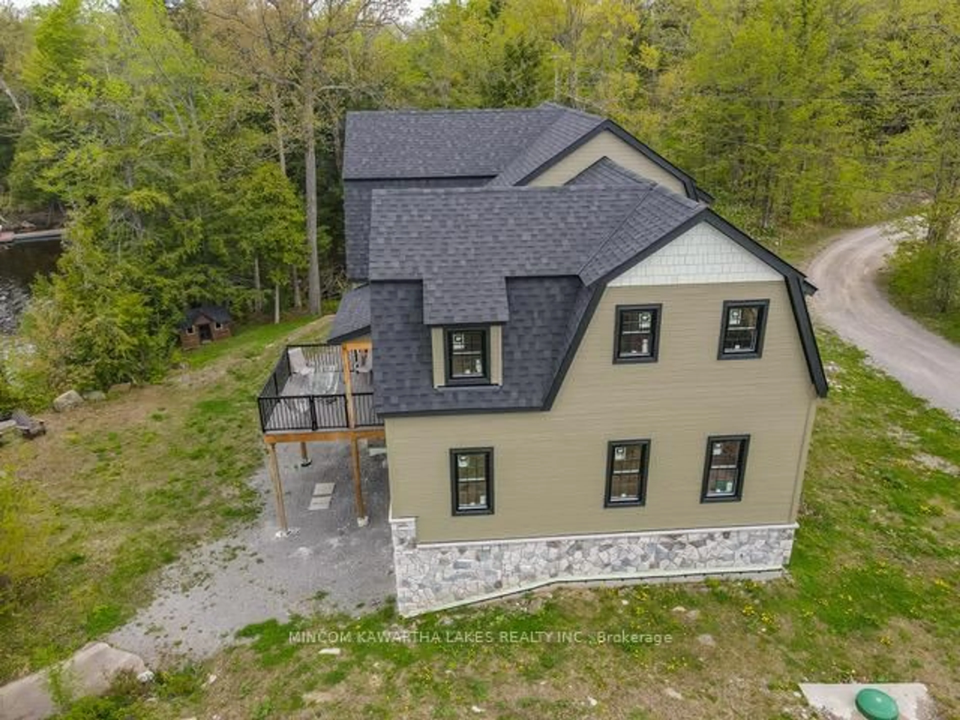 A pic from outside/outdoor area/front of a property/back of a property/a pic from drone, building for 16 Evergreen Way, Trent Lakes Ontario K0M 1A0