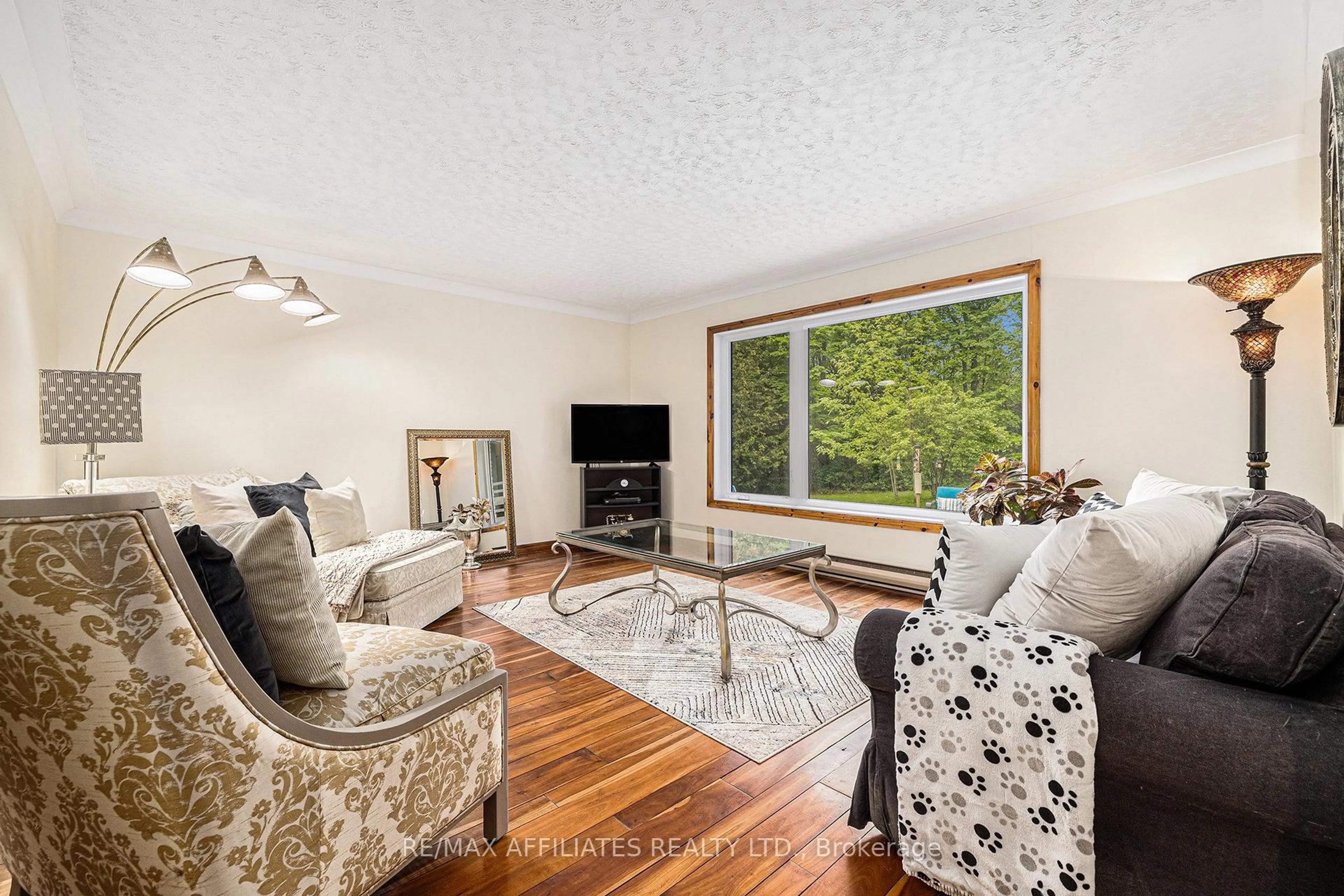 Living room with furniture, wood/laminate floor for 187 Perth Rd, Smiths Falls Ontario K7A 4S7