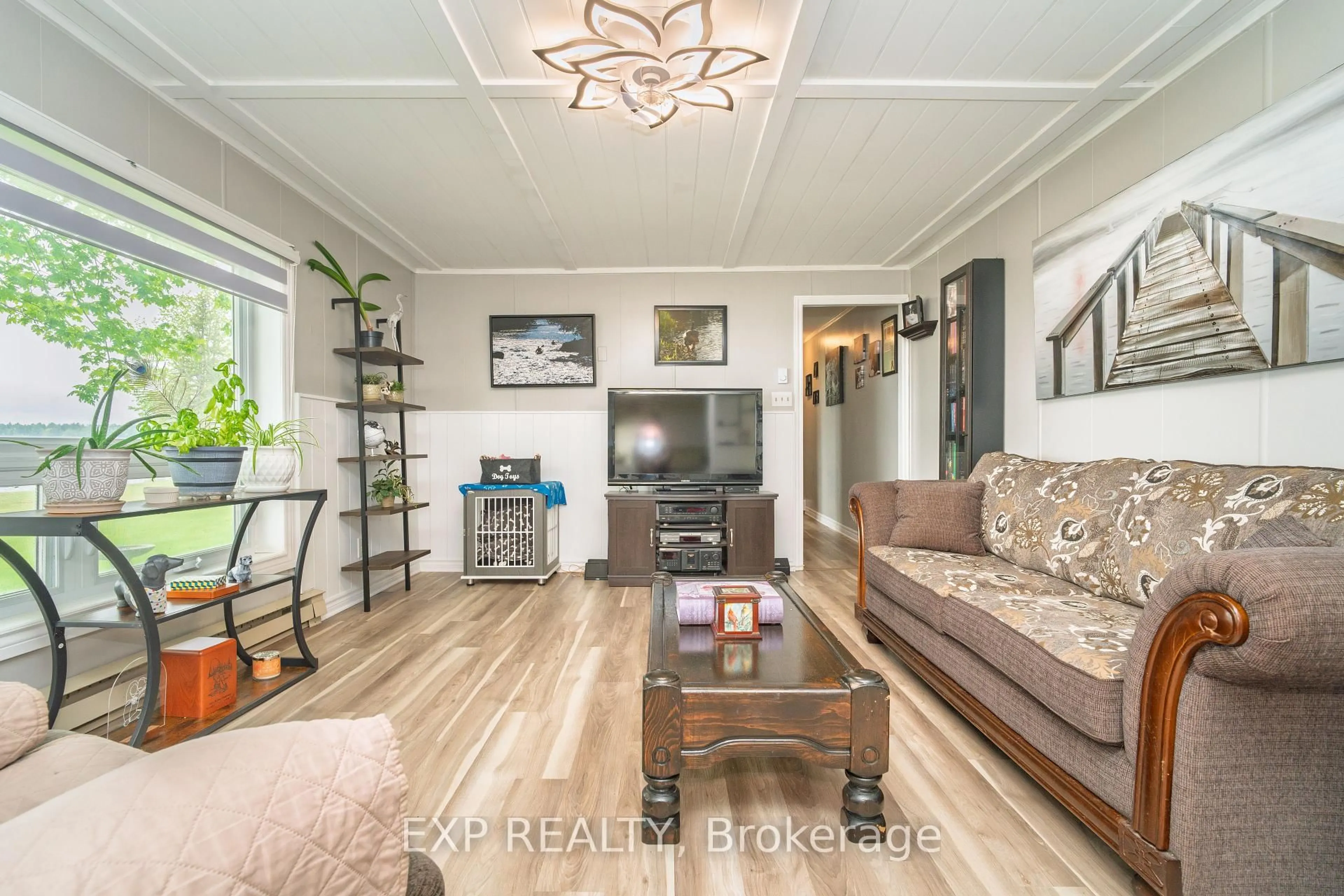 Living room with furniture, wood/laminate floor for 5 Evergreen Lane, White Lake Ontario K0A 3L0