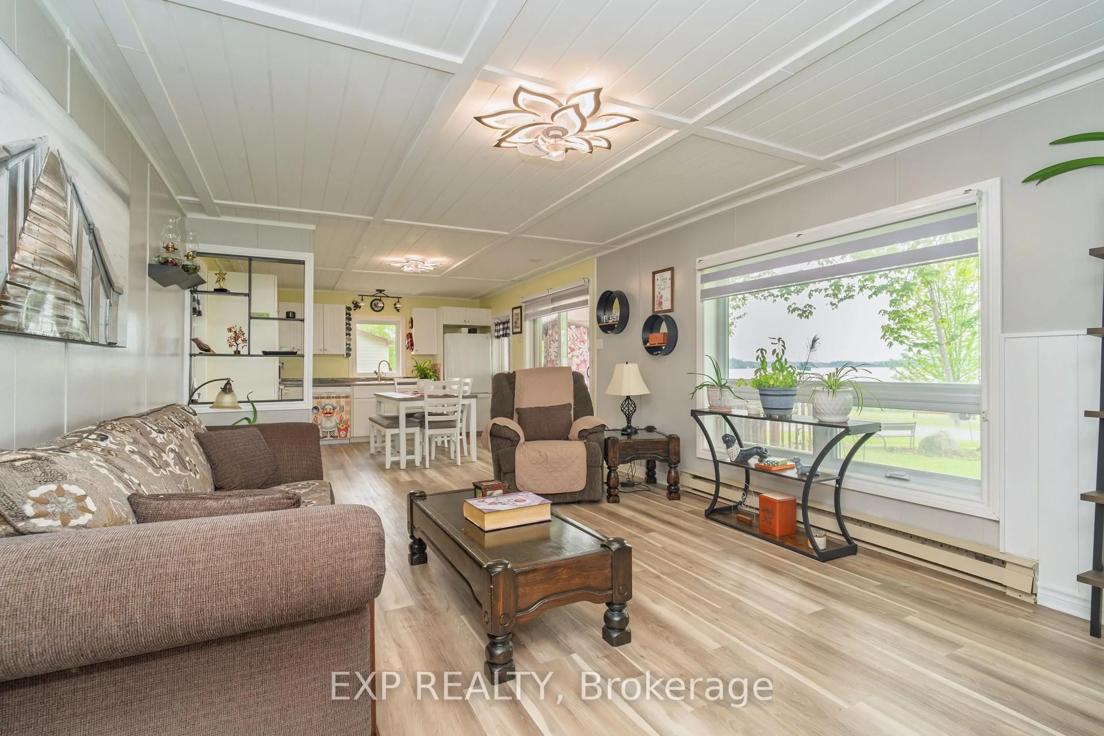 Living room with furniture, wood/laminate floor for 5 Evergreen Lane, White Lake Ontario K0A 3L0