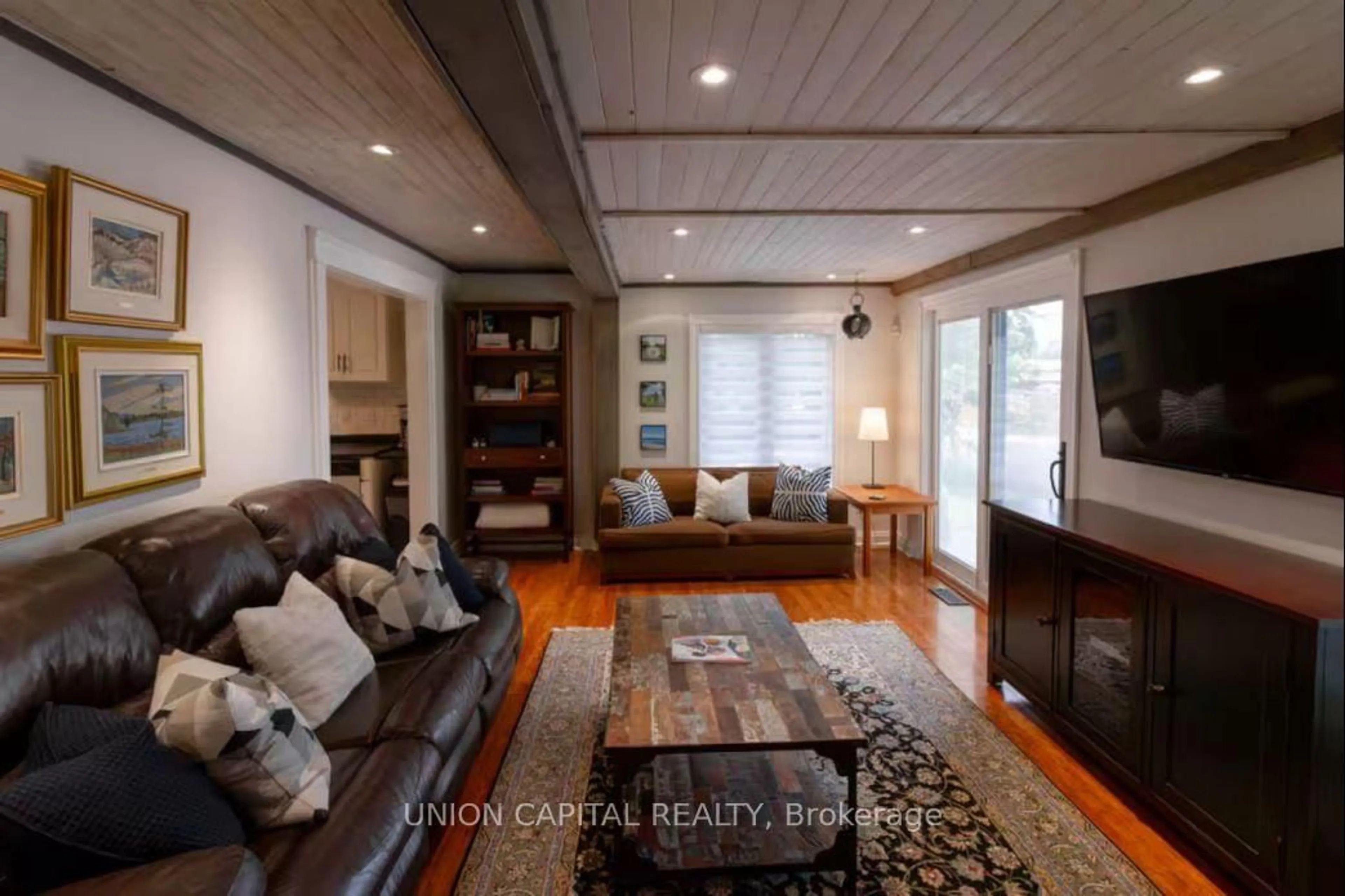 Living room with furniture, wood/laminate floor for 6 Bay St, Prince Edward County Ontario K0K 2T0