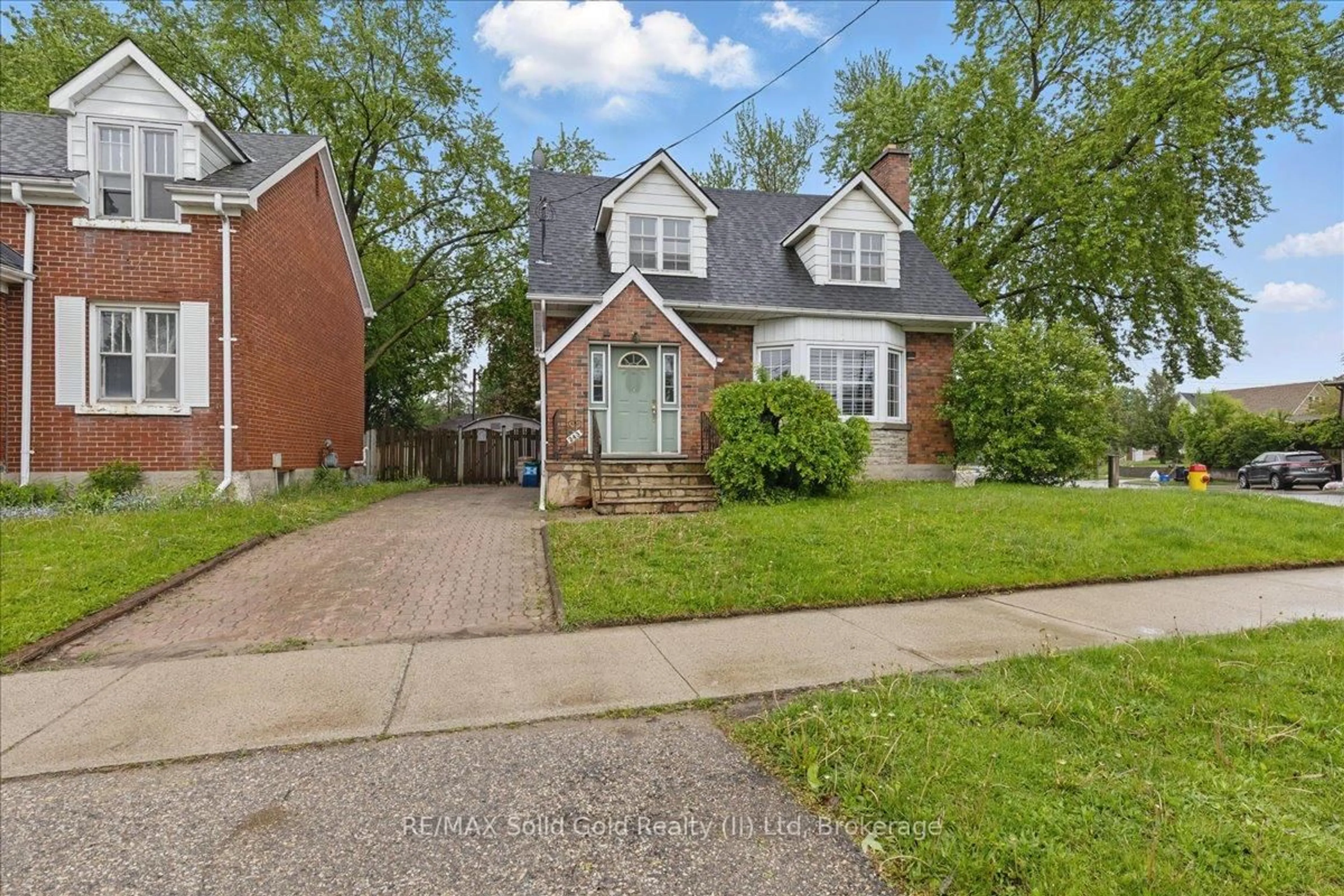 Home with brick exterior material, street for 243 Sydney St, Kitchener Ontario N2G 3V6