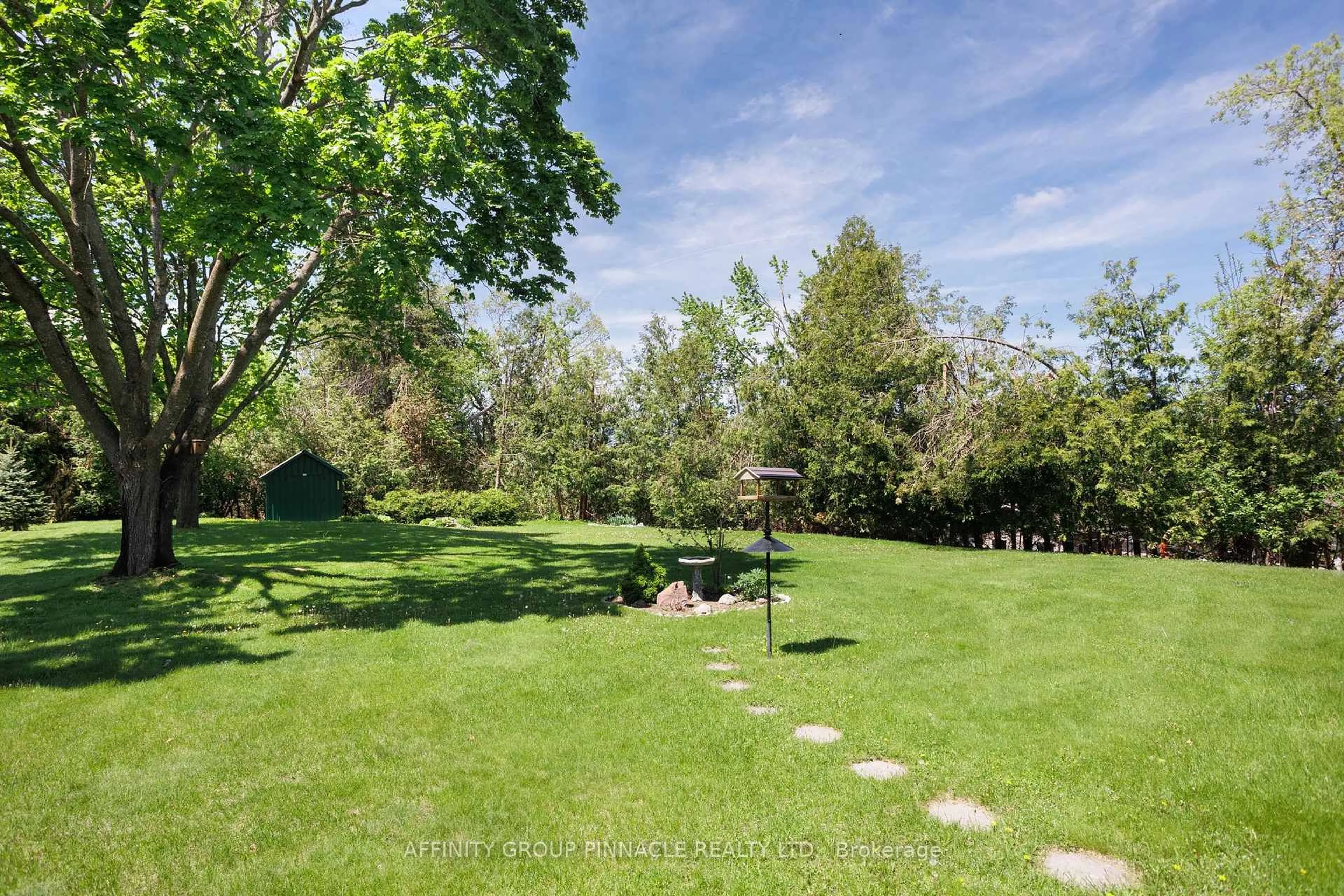 A pic from outside/outdoor area/front of a property/back of a property/a pic from drone, forest/trees view for 121 Clifton St, Kawartha Lakes Ontario K0M 1N0