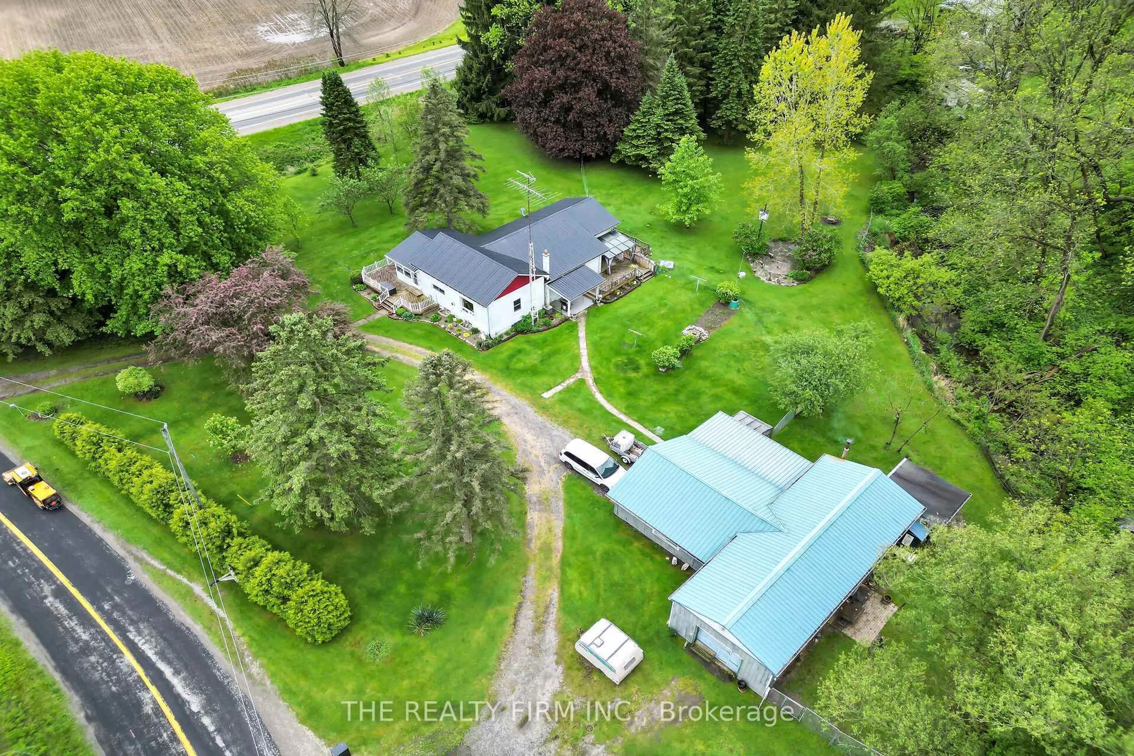 A pic from outside/outdoor area/front of a property/back of a property/a pic from drone, street for 4053 Thomas Rd, Southwold Ontario N5L 1J2