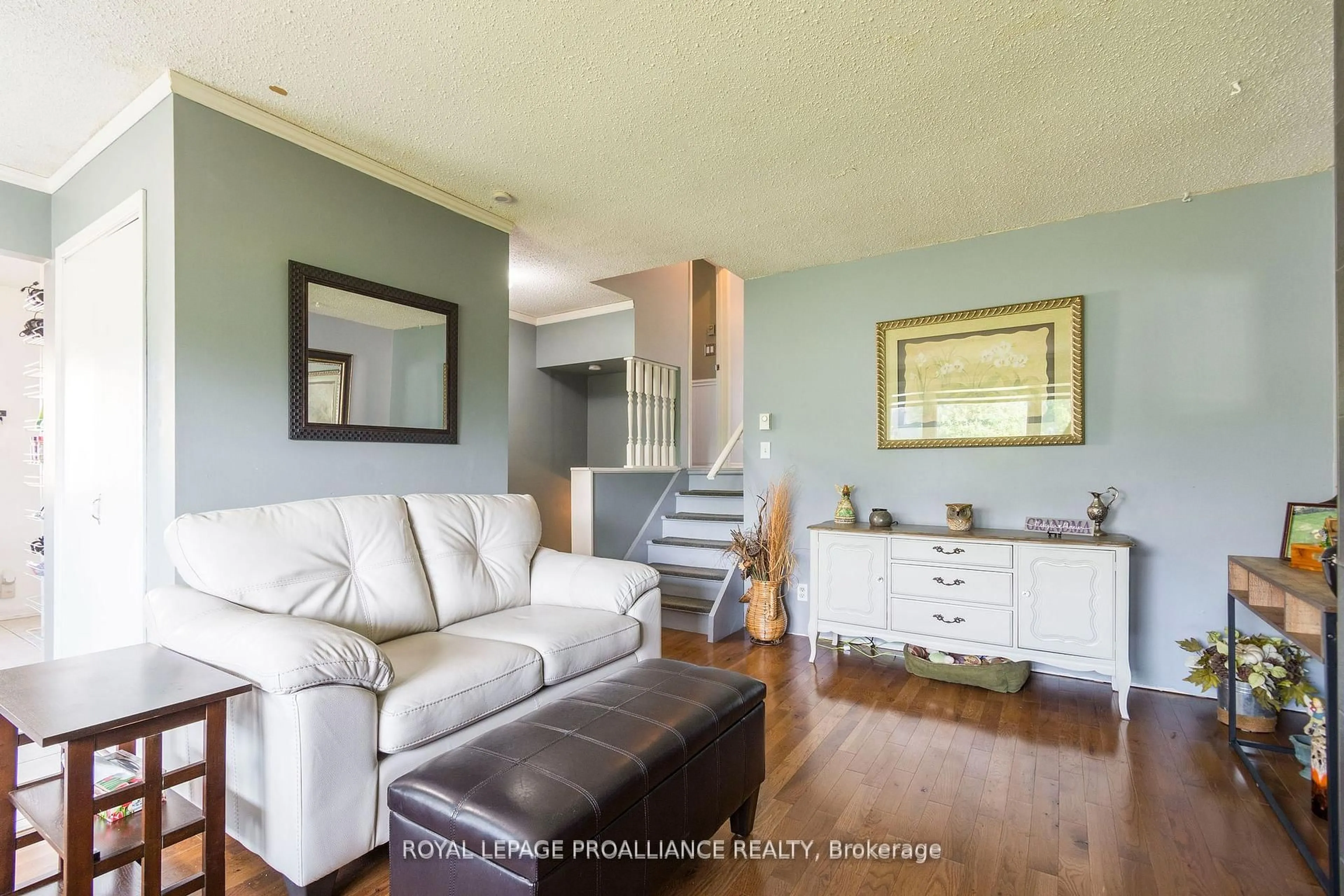 Living room with furniture, wood/laminate floor for 8 Birch St, Quinte West Ontario K8V 6J1