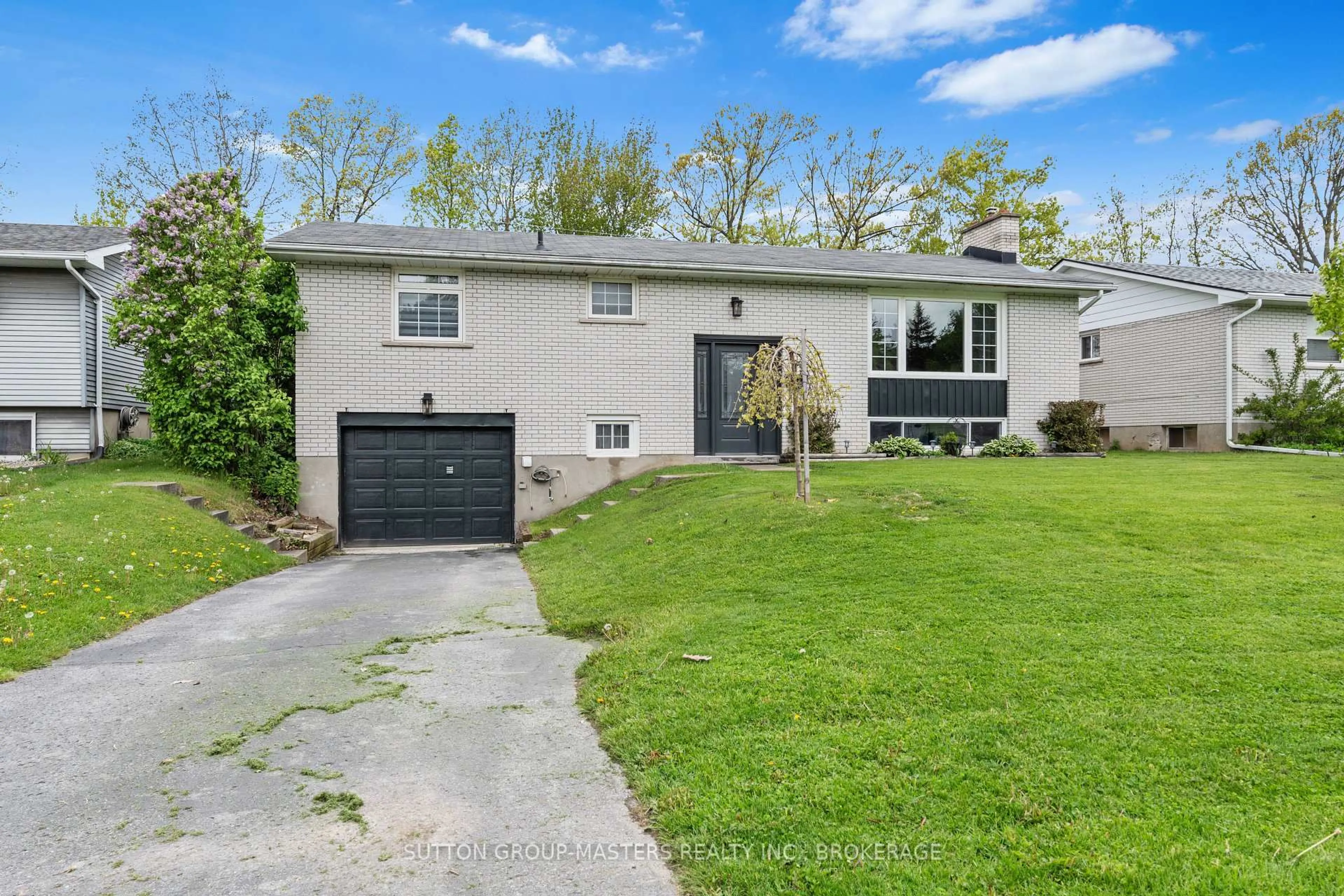 Home with vinyl exterior material, street for 905 Auden Park Dr, Kingston Ontario K7M 4T8