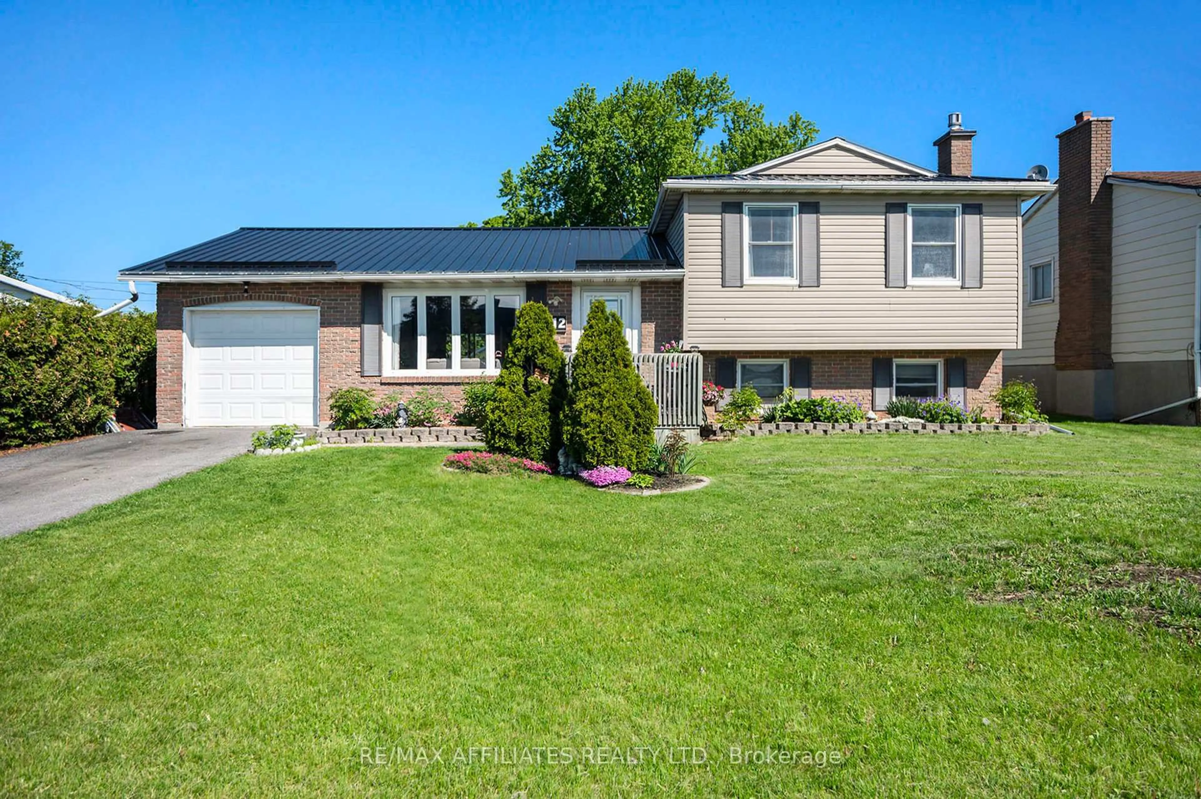 Home with vinyl exterior material, street for 12 Ross St, Smiths Falls Ontario K7A 4V6