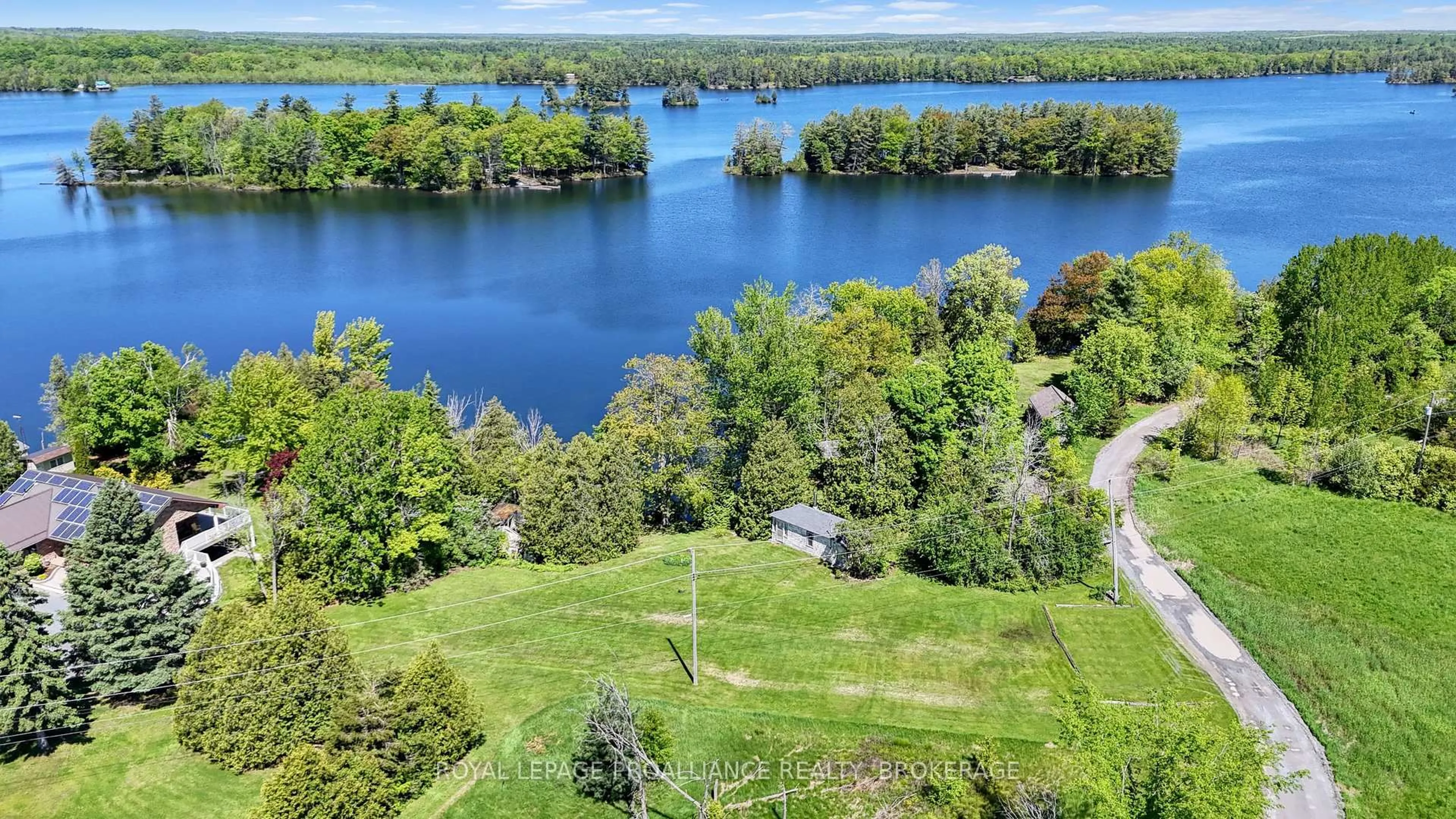 A pic from outside/outdoor area/front of a property/back of a property/a pic from drone, water/lake/river/ocean view for 4790 Toddle Lane, Battersea Ontario K0H 1H0