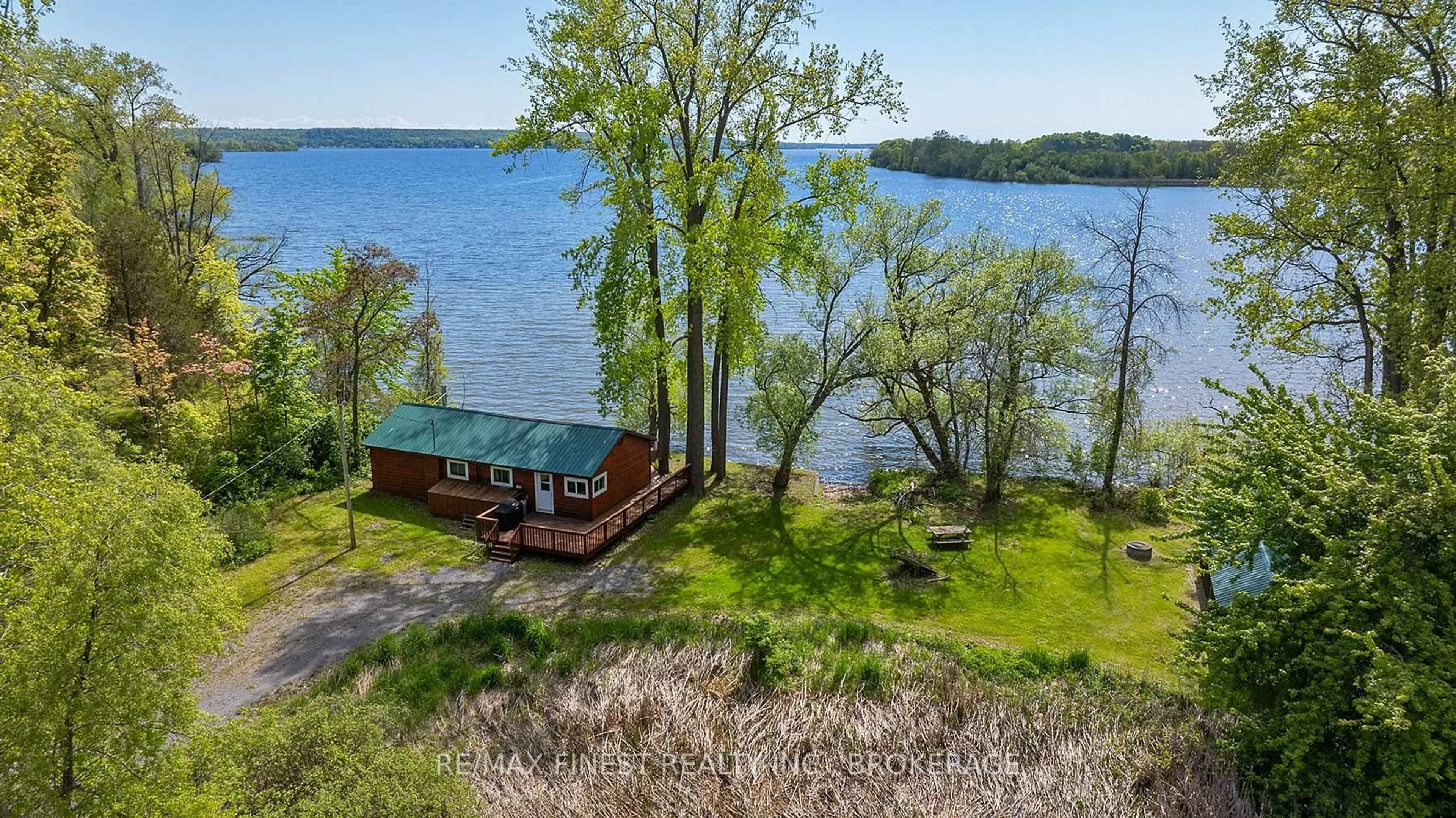 A pic from outside/outdoor area/front of a property/back of a property/a pic from drone, water/lake/river/ocean view for 201 Perch Cove Lane, Napanee Ontario K7R 3K7