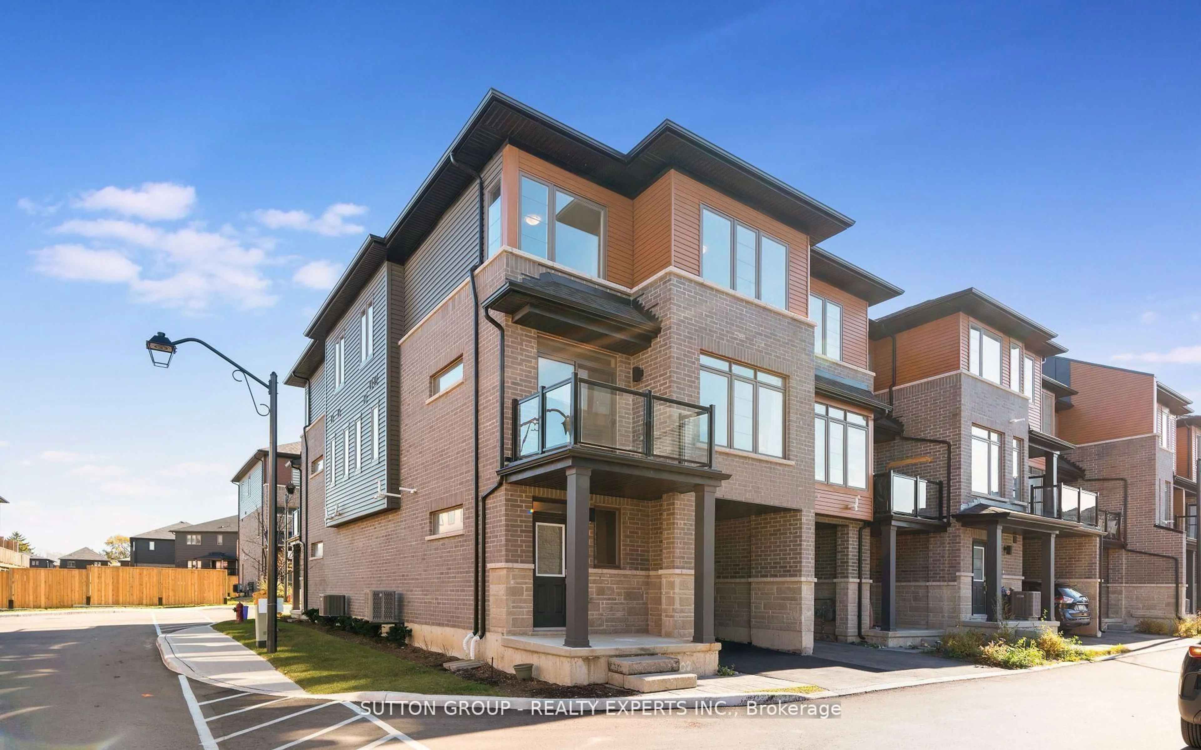Home with brick exterior material, street for 61 Soho St #102, Hamilton Ontario L8J 0M6