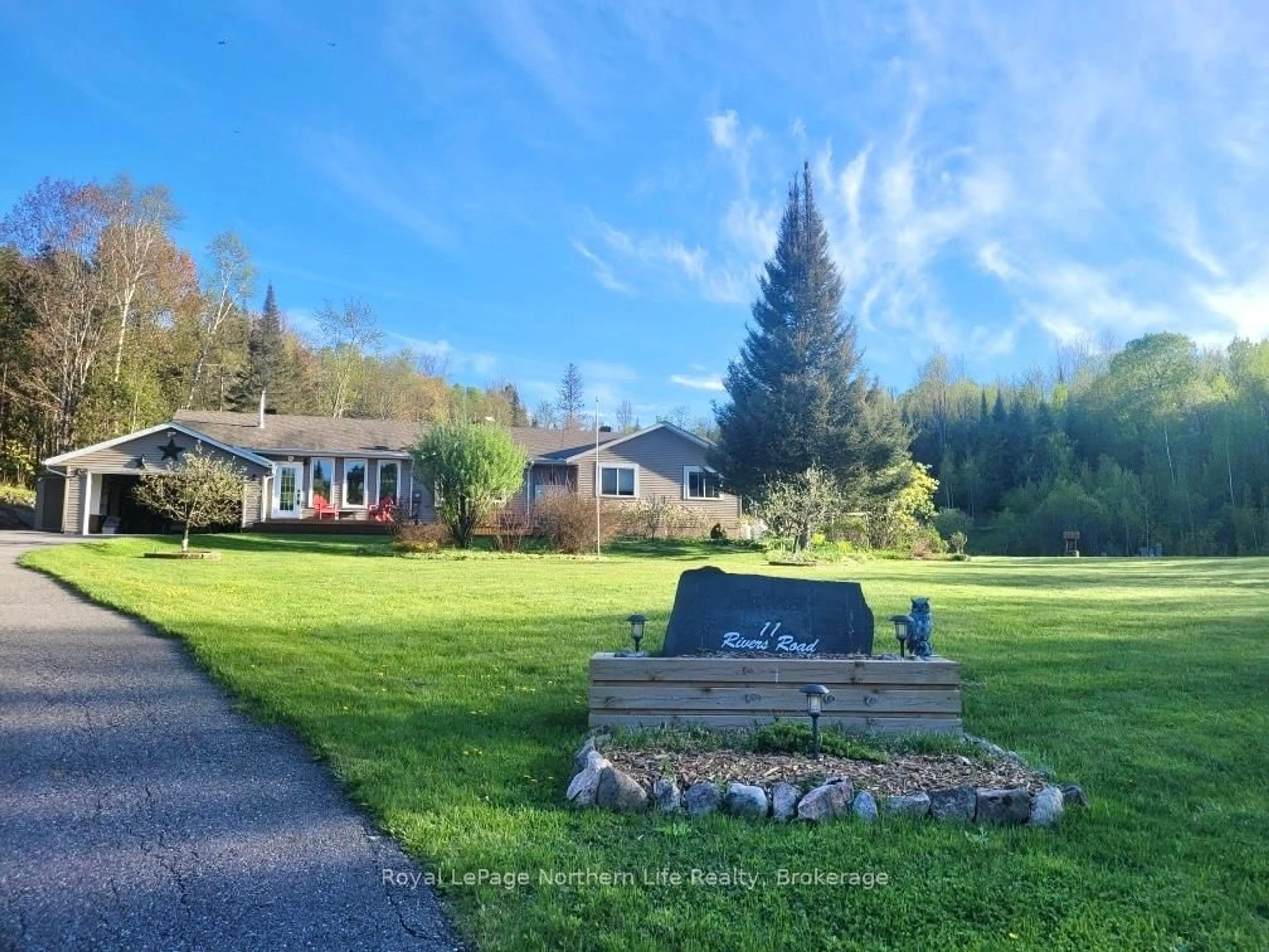A pic from outside/outdoor area/front of a property/back of a property/a pic from drone, mountain view for 11 Rivers Rd, Callander Ontario P0H 1H0