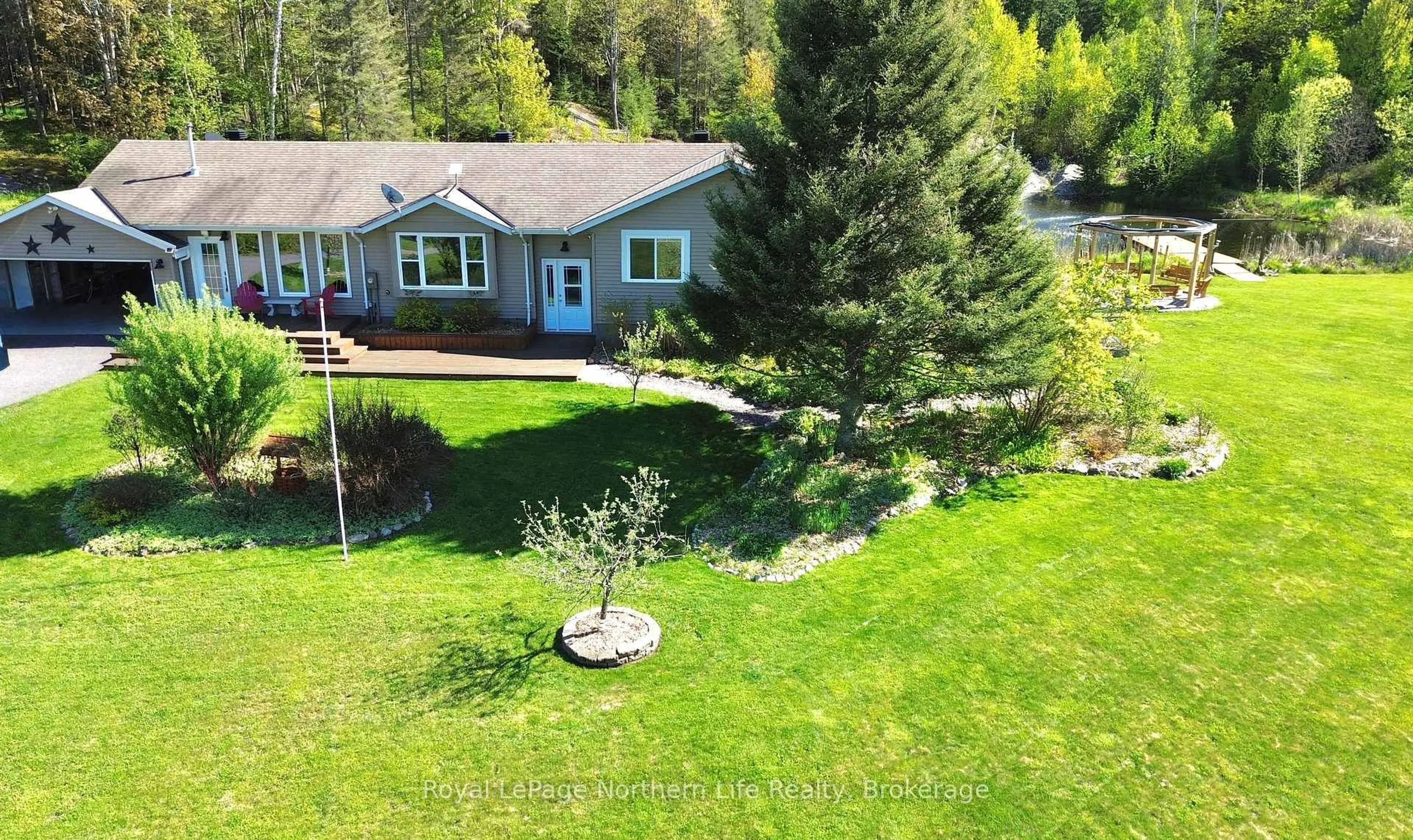 A pic from outside/outdoor area/front of a property/back of a property/a pic from drone, unknown for 11 Rivers Rd, Callander Ontario P0H 1H0