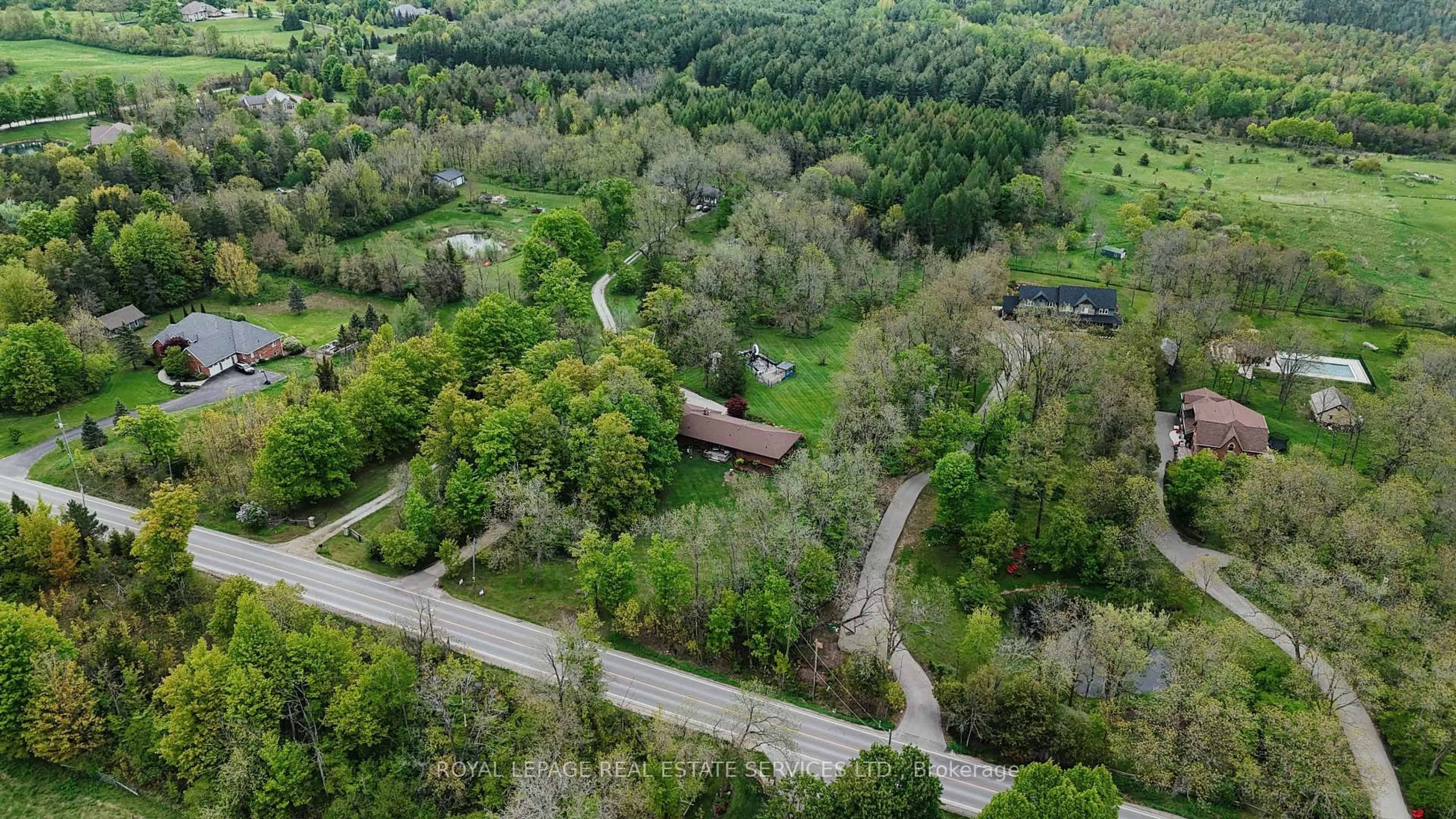 A pic from outside/outdoor area/front of a property/back of a property/a pic from drone, forest/trees view for 4711 Watson Road South Rd, Puslinch Ontario N0B 2J0