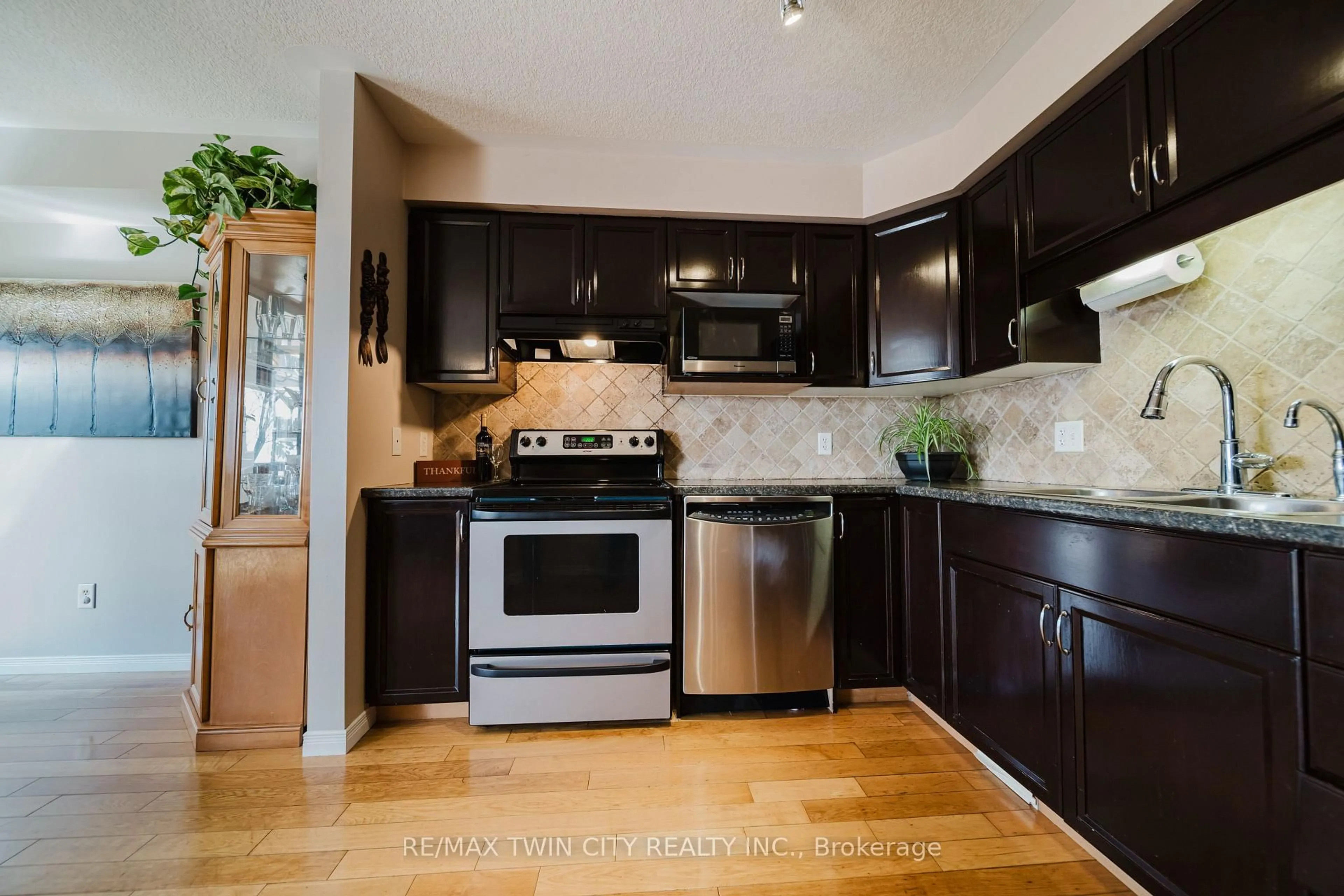 Open concept kitchen, wood/laminate floor for 243 Brenneman Dr, Wilmot Ontario N3A 4N2