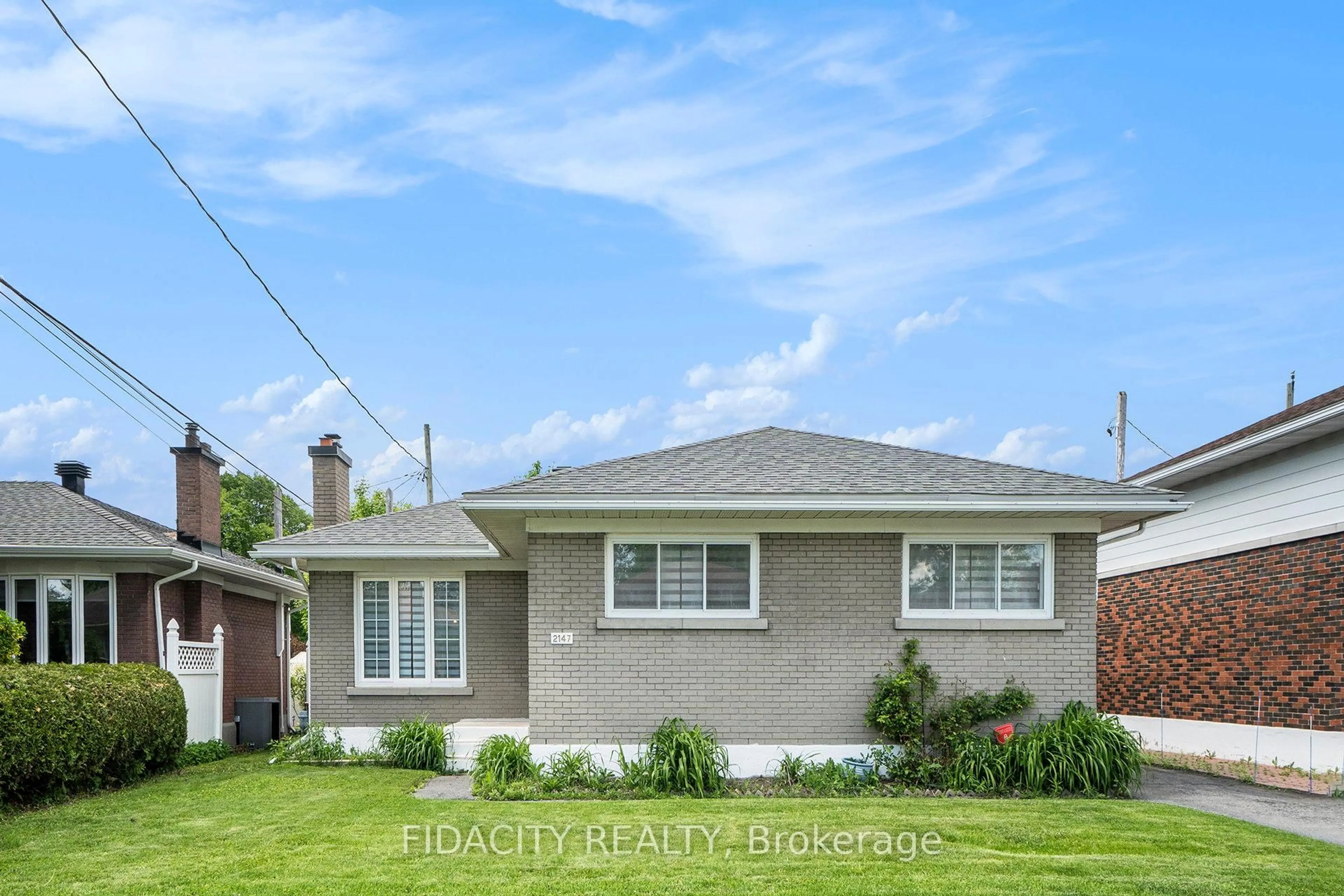 Home with vinyl exterior material, street for 2147 Iris St, Ottawa Ontario K2C 1B4