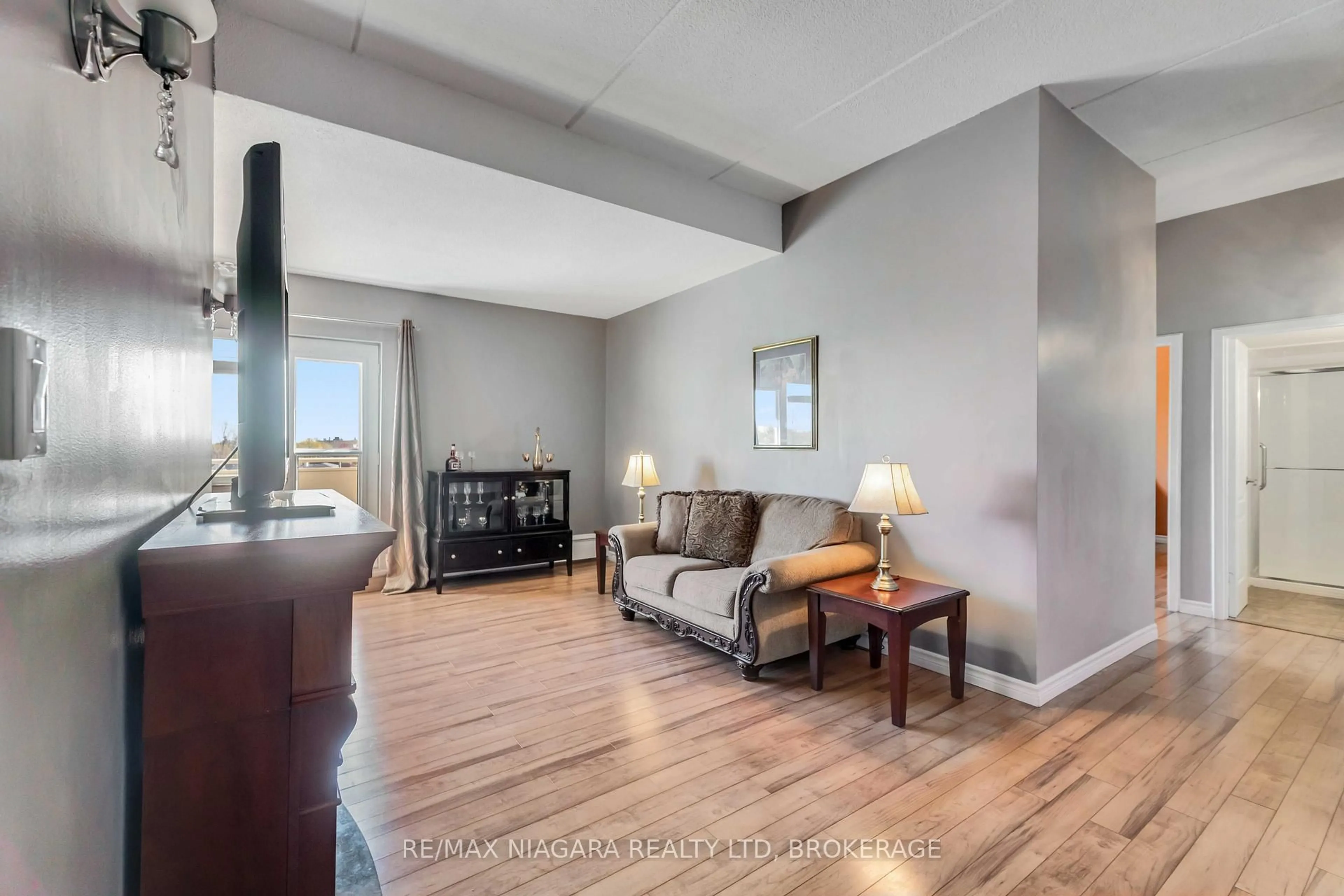 Living room with furniture, unknown for 198 Scott St #506, St. Catharines Ontario L2N 5T3