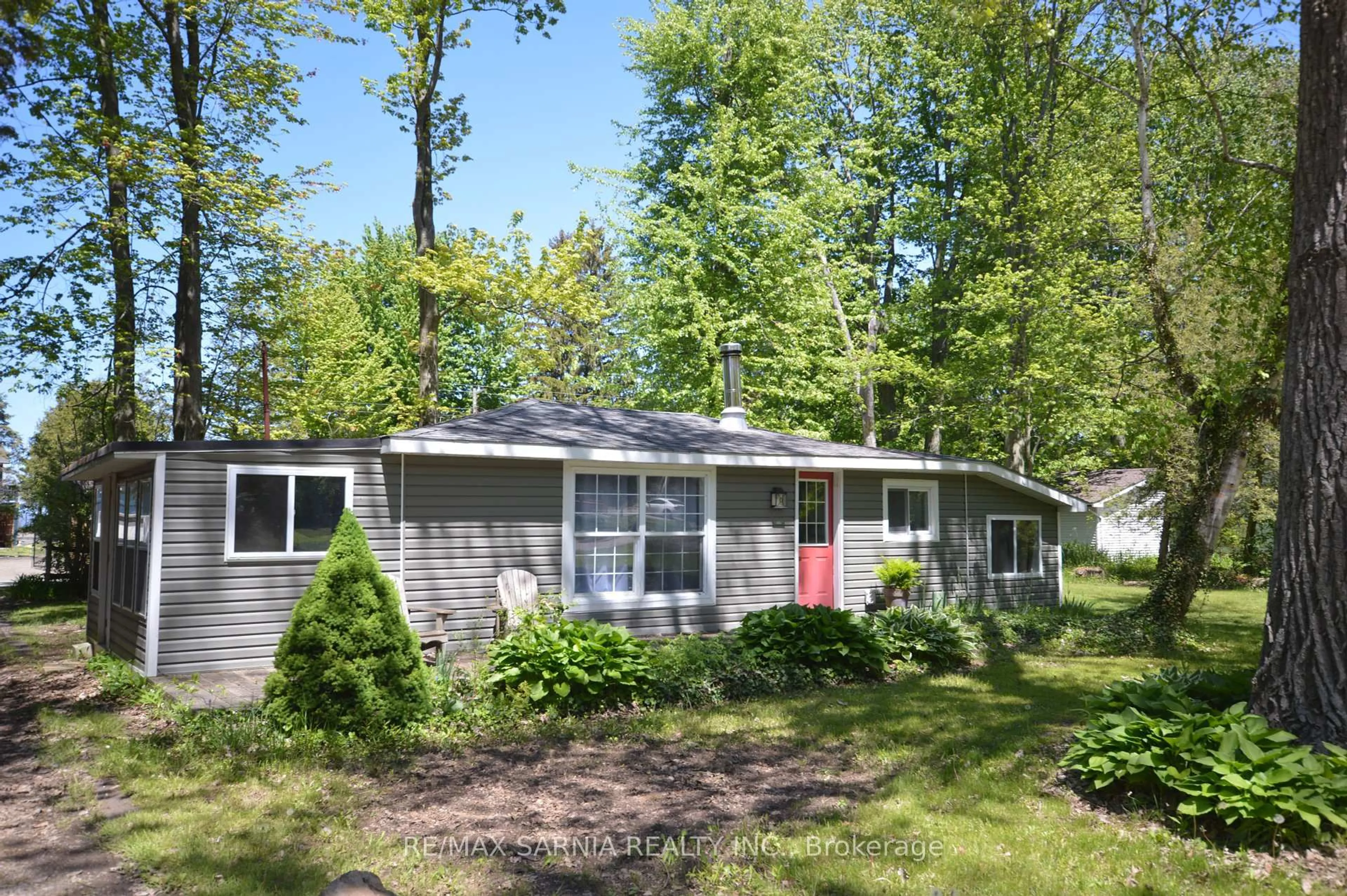Home with vinyl exterior material, street for 6208 LONDON Rd, Lambton Shores Ontario N0N 1J1
