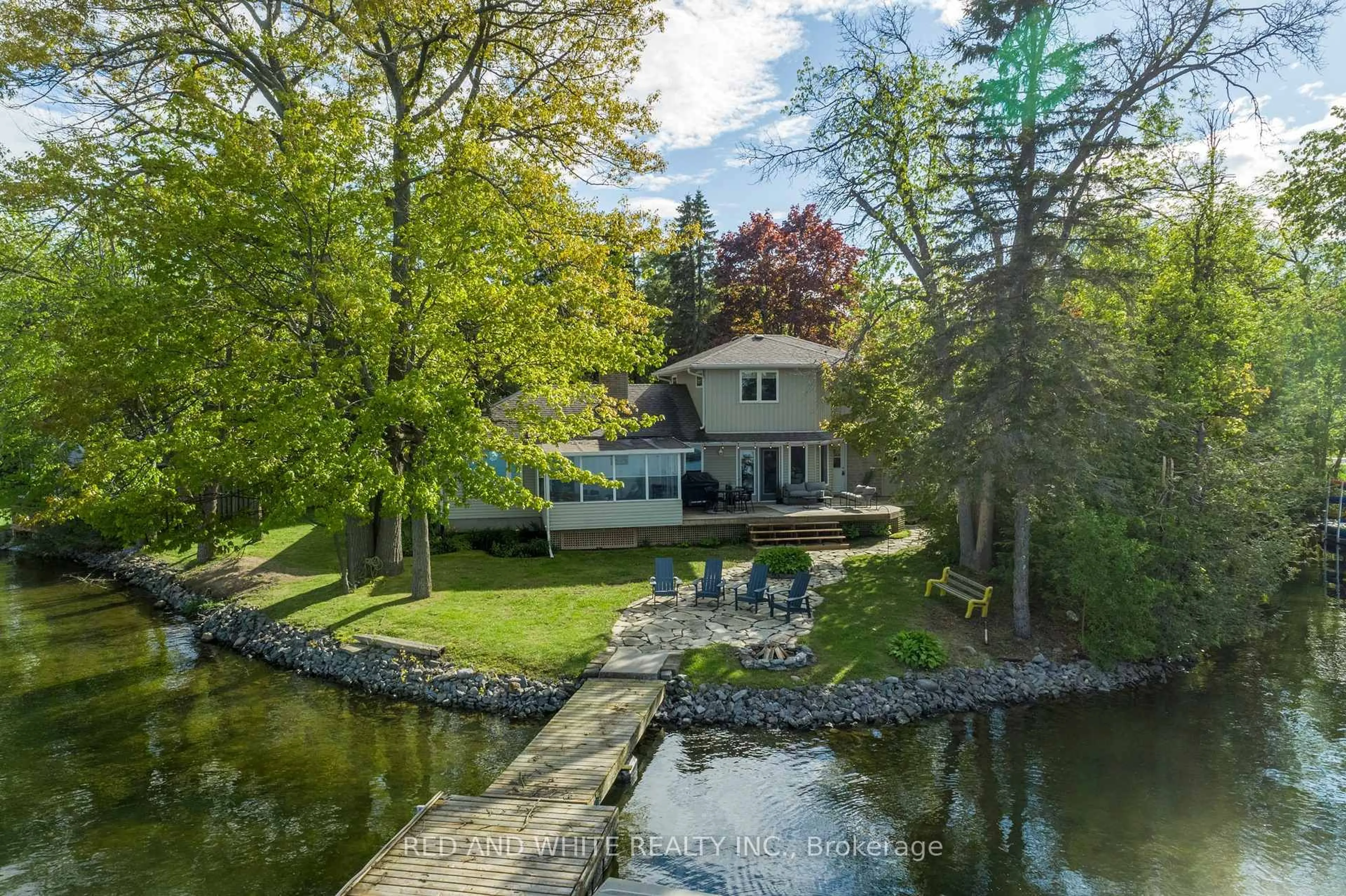 A pic from outside/outdoor area/front of a property/back of a property/a pic from drone, water/lake/river/ocean view for 409 Gifford Dr, Selwyn Ontario K9J 6X2