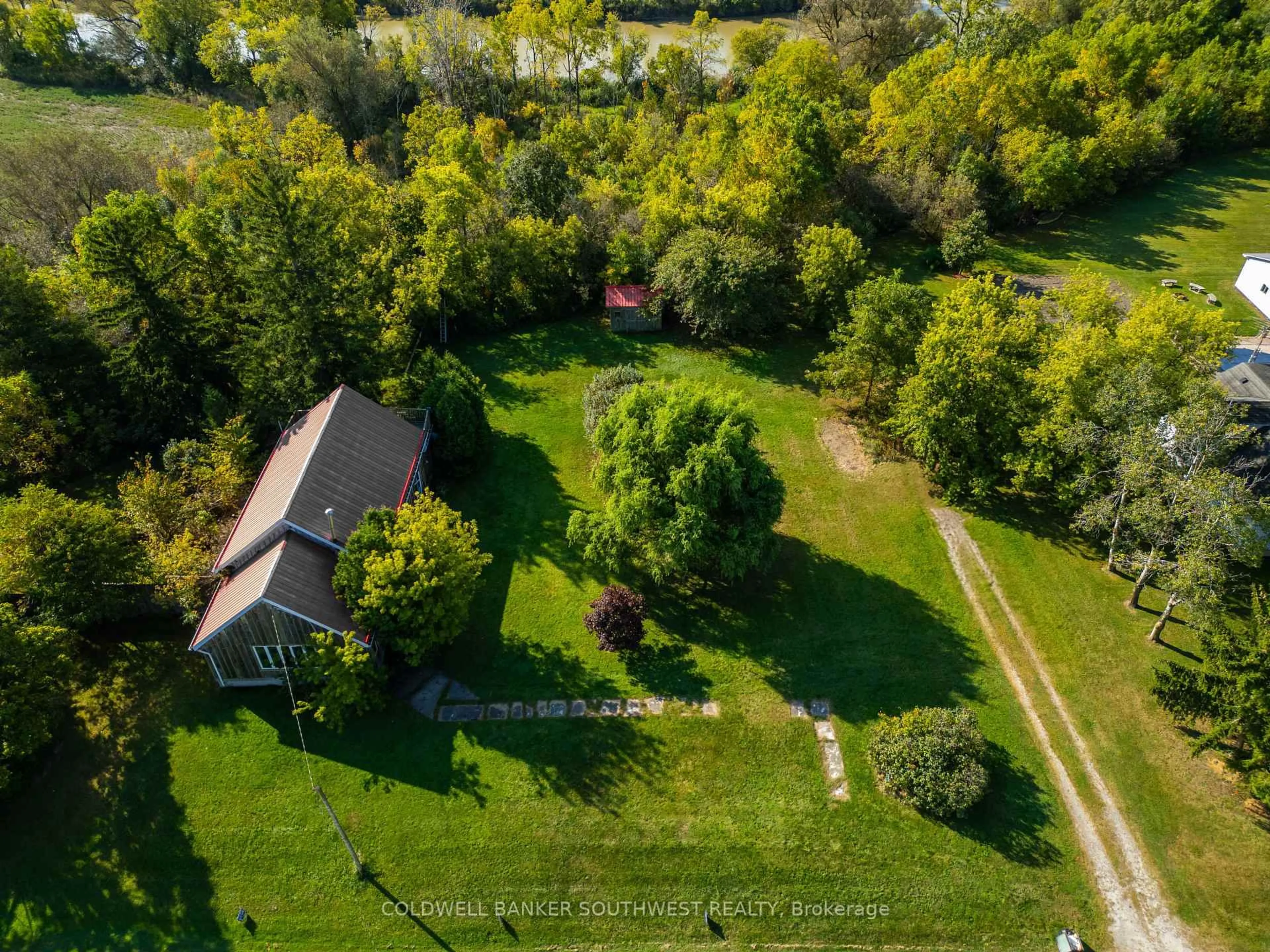 A pic from outside/outdoor area/front of a property/back of a property/a pic from drone, forest/trees view for 1405 Main St, St. Clair Ontario N0P 2R0