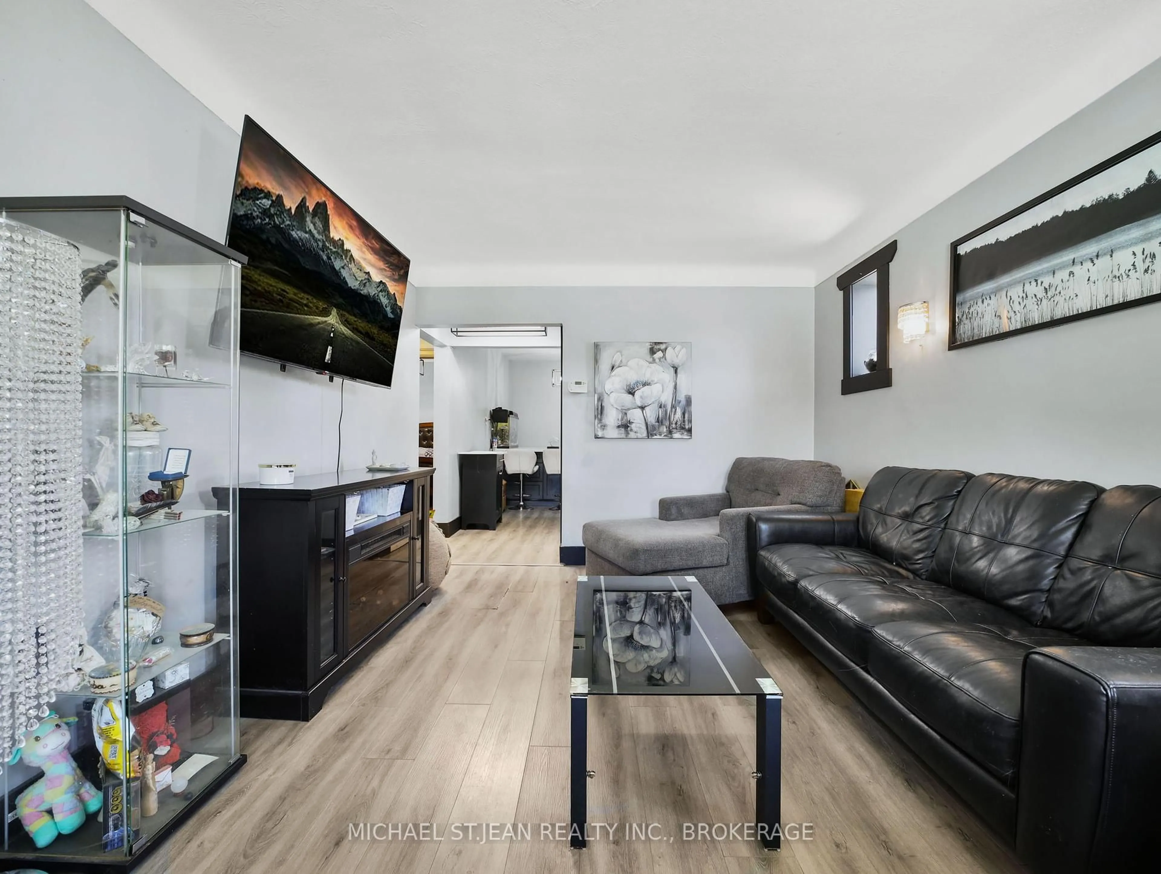 Living room with furniture, wood/laminate floor for 89 Cameron Ave, Hamilton Ontario L8K 2X3