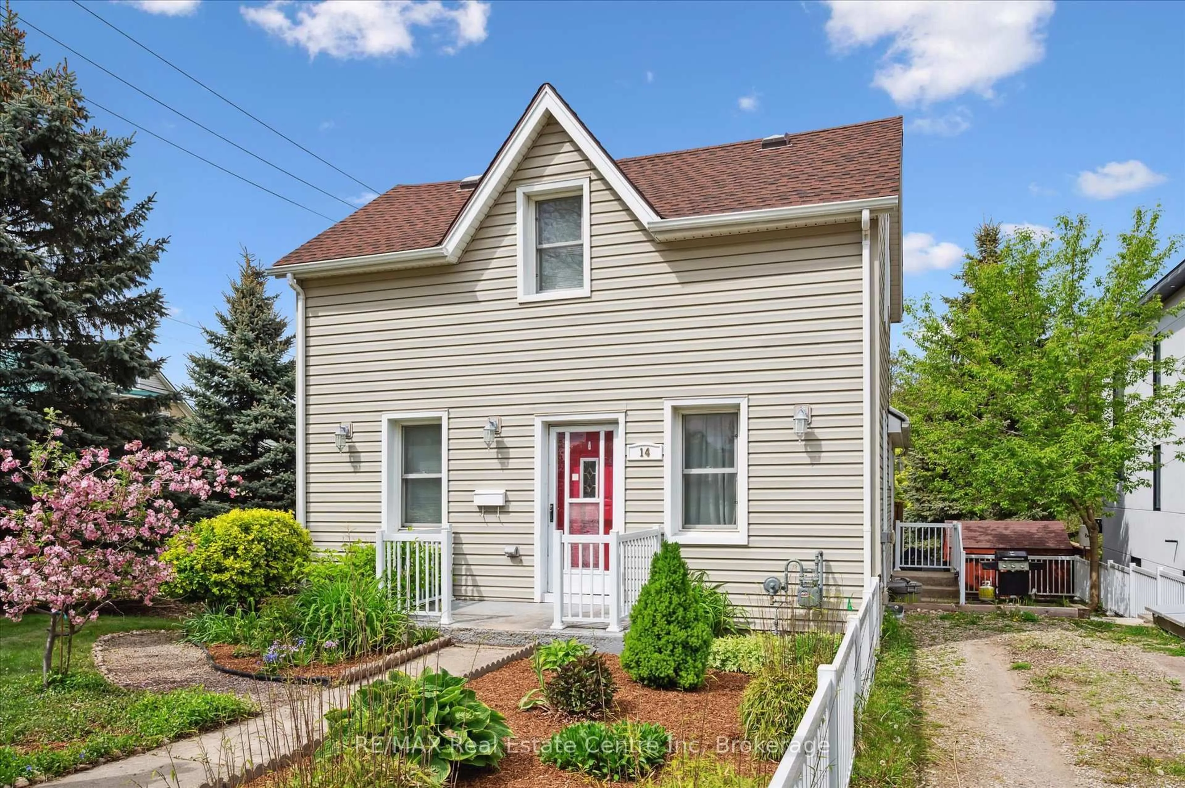Home with vinyl exterior material, street for 14 Riverside Dr, Woolwich Ontario N3B 1R1