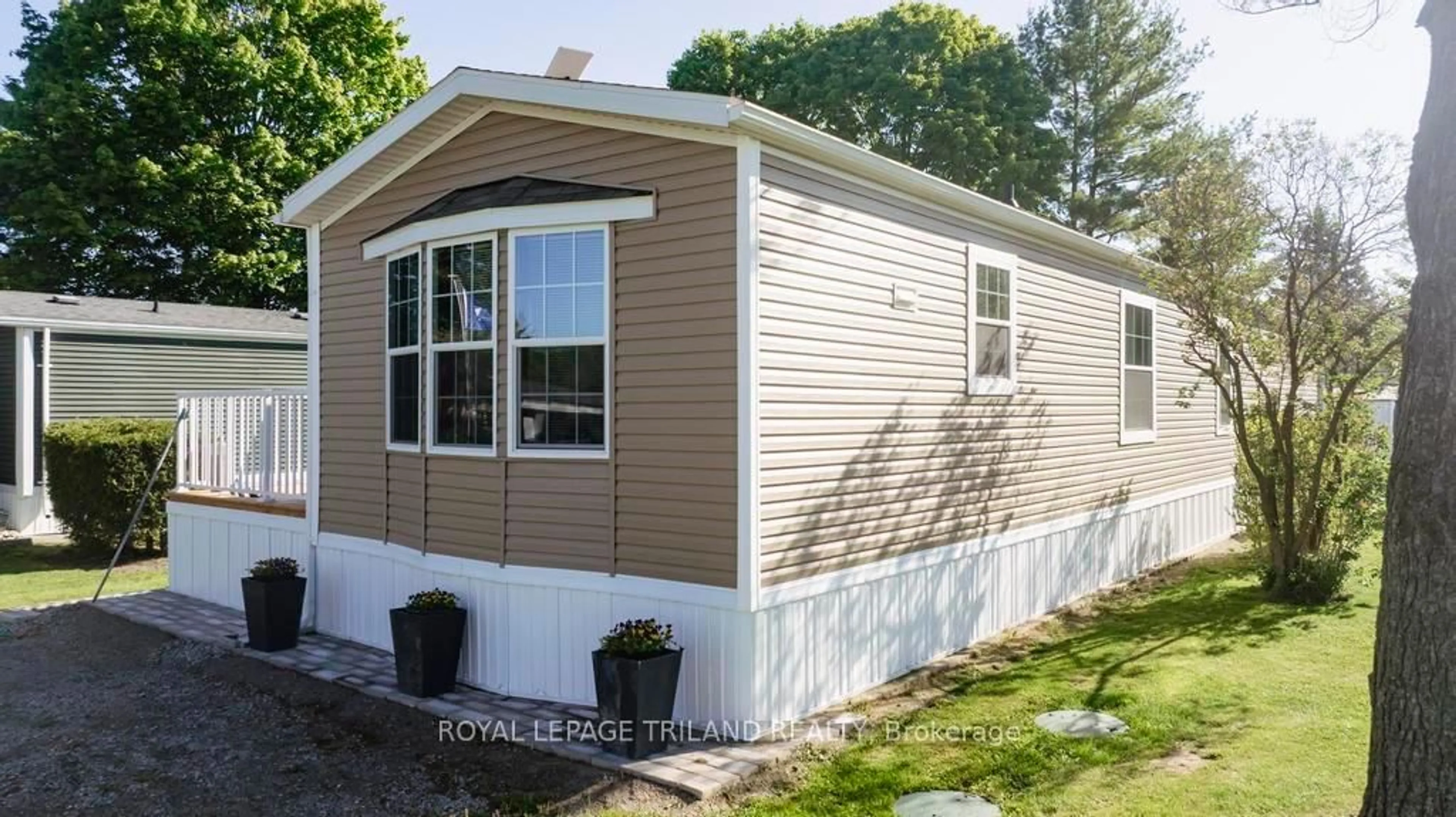 Home with vinyl exterior material, street for 9385 Ipperwash Rd #14, Lambton Shores Ontario N0N 1J3