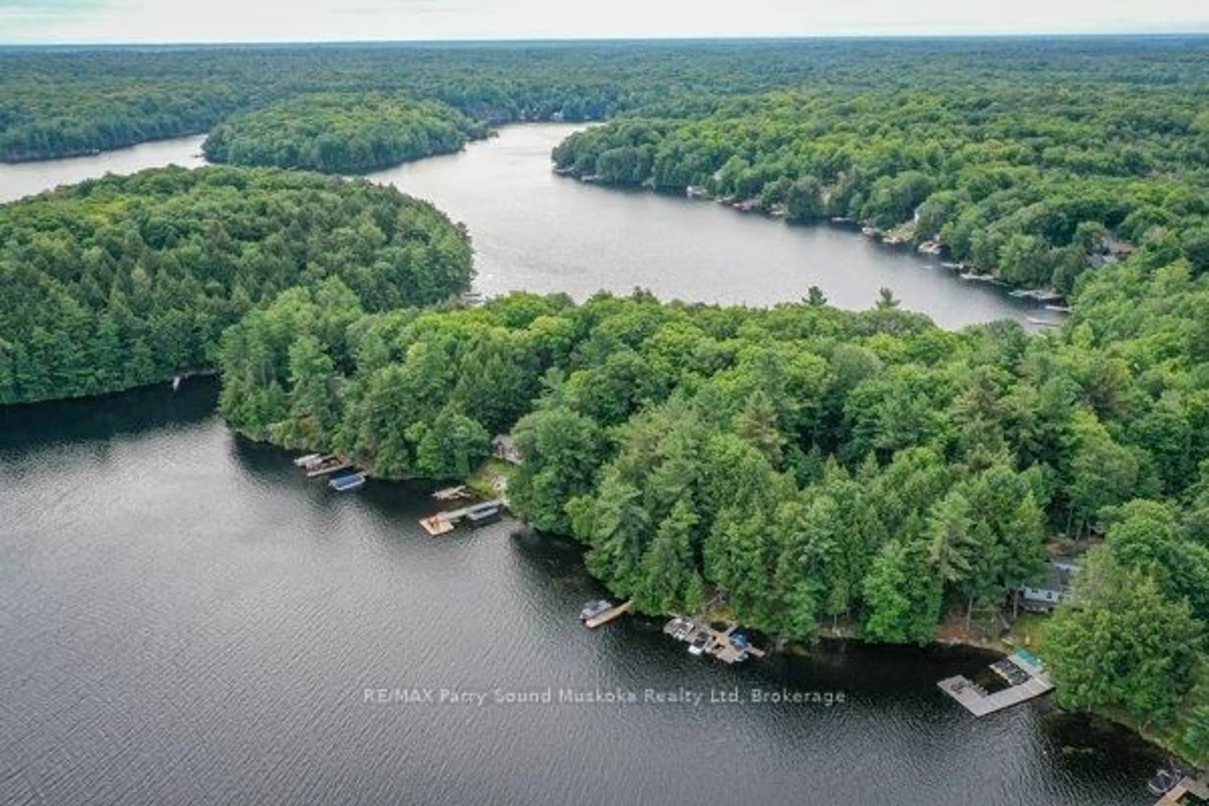 A pic from outside/outdoor area/front of a property/back of a property/a pic from drone, water/lake/river/ocean view for 13 Shady Lane, Seguin Ontario P2A 0B2