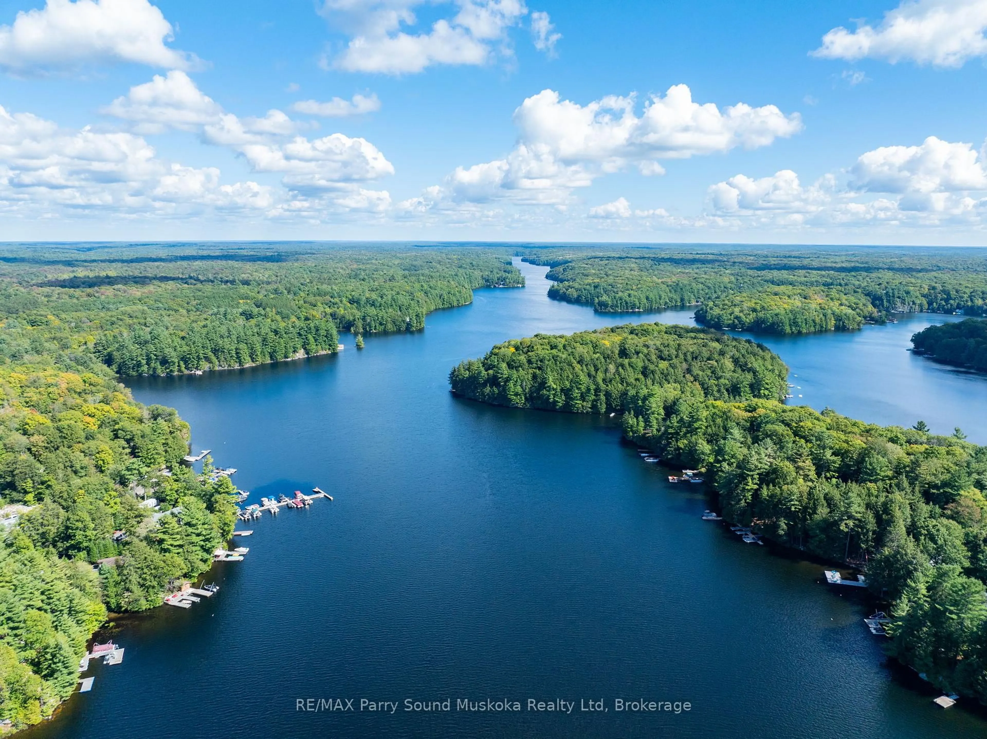 A pic from outside/outdoor area/front of a property/back of a property/a pic from drone, water/lake/river/ocean view for 13 Shady Lane, Seguin Ontario P2A 0B2