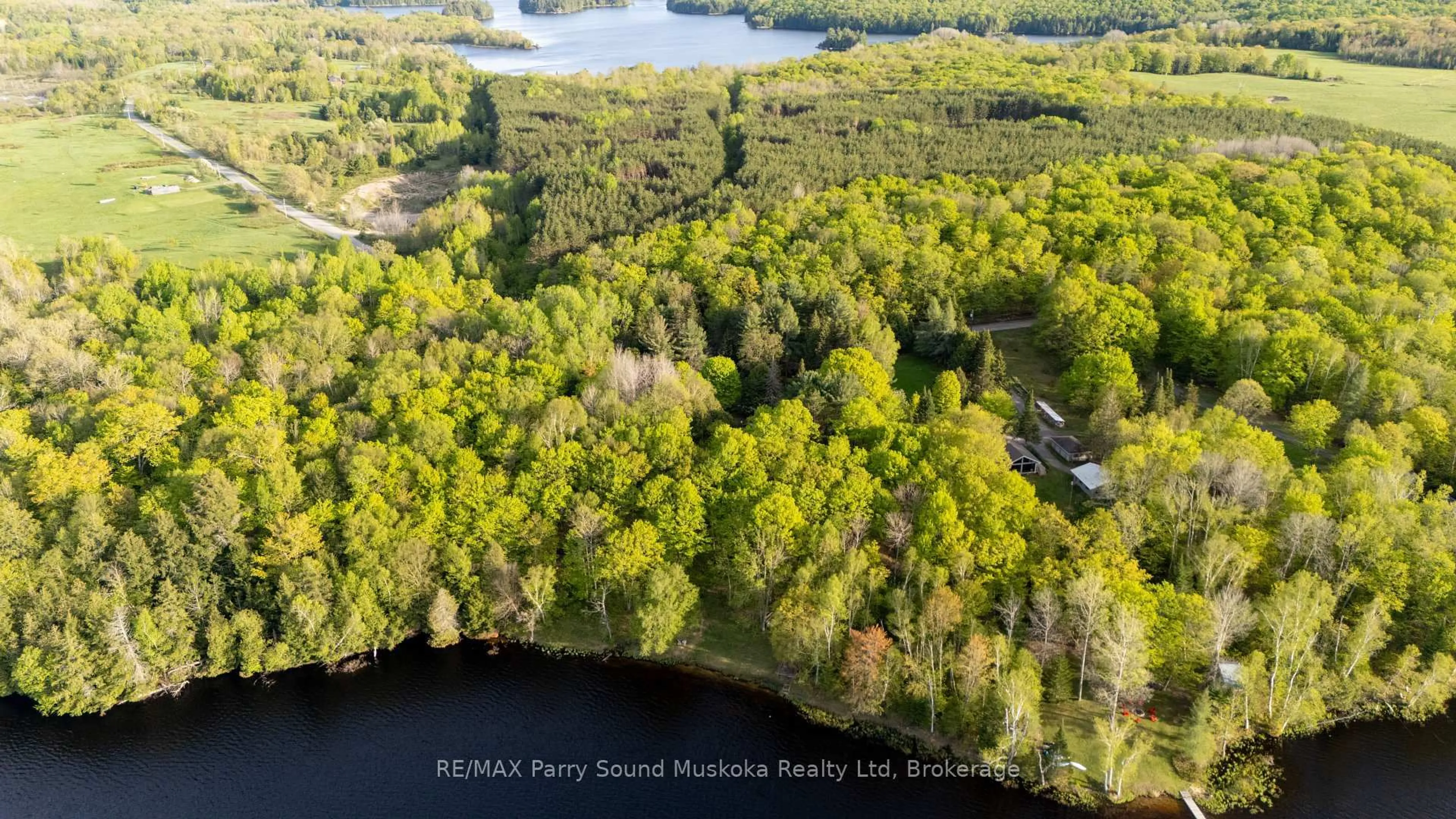 A pic from outside/outdoor area/front of a property/back of a property/a pic from drone, water/lake/river/ocean view for 82 Bradley Rd, Seguin Ontario P2A 2W9