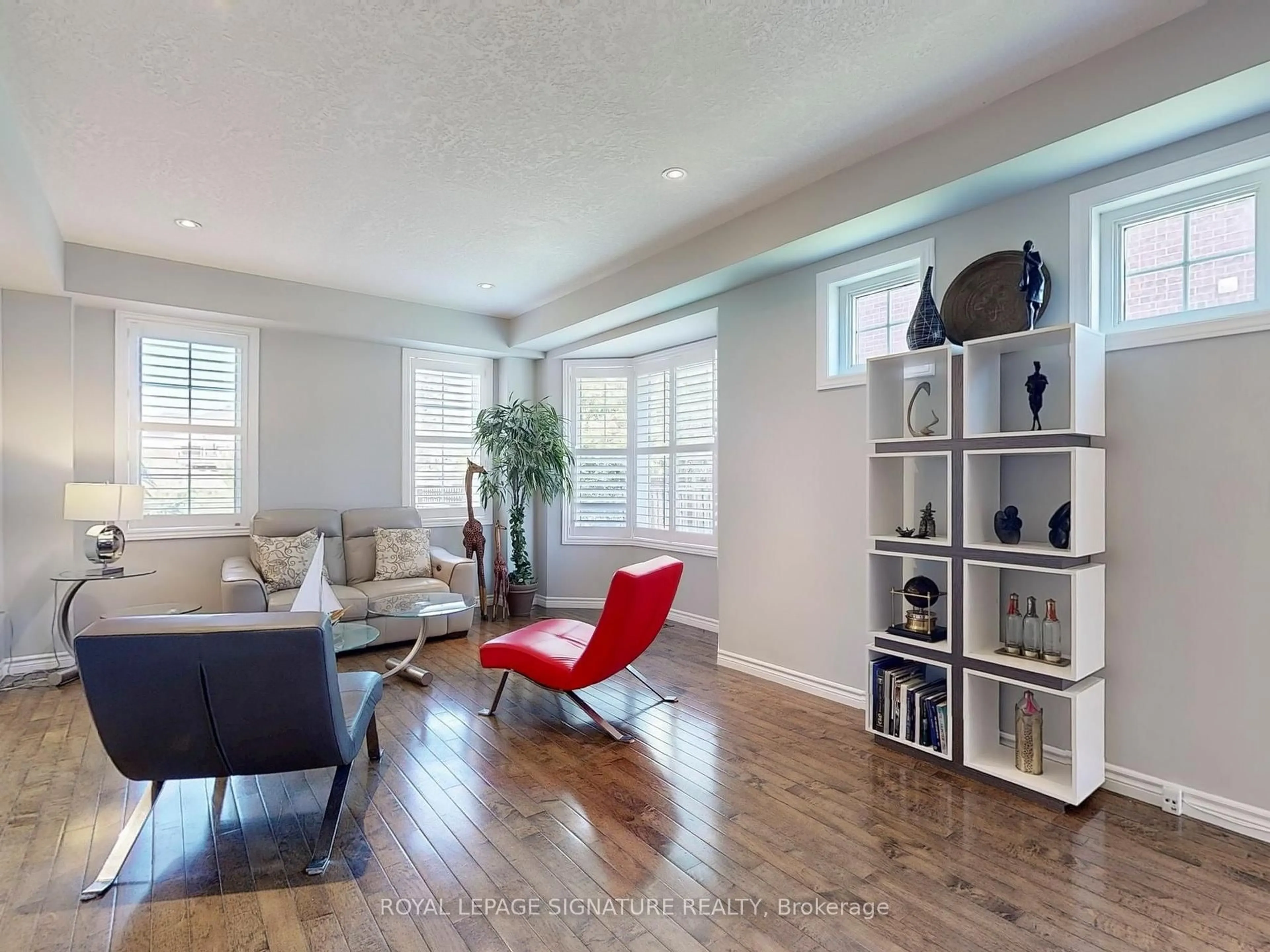 Living room with furniture, wood/laminate floor for 99 Panabaker Dr #4, Hamilton Ontario L9G 5E3
