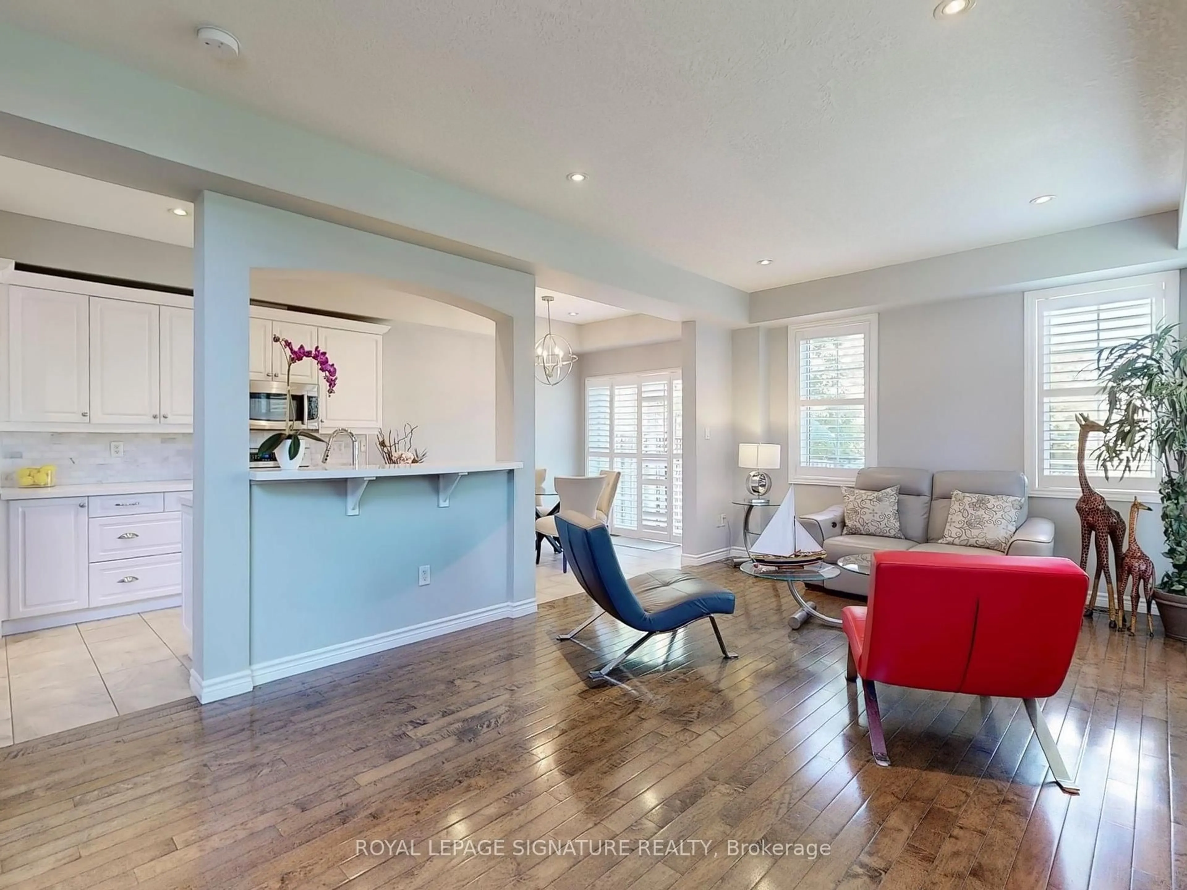 Living room with furniture, wood/laminate floor for 99 Panabaker Dr #4, Hamilton Ontario L9G 5E3