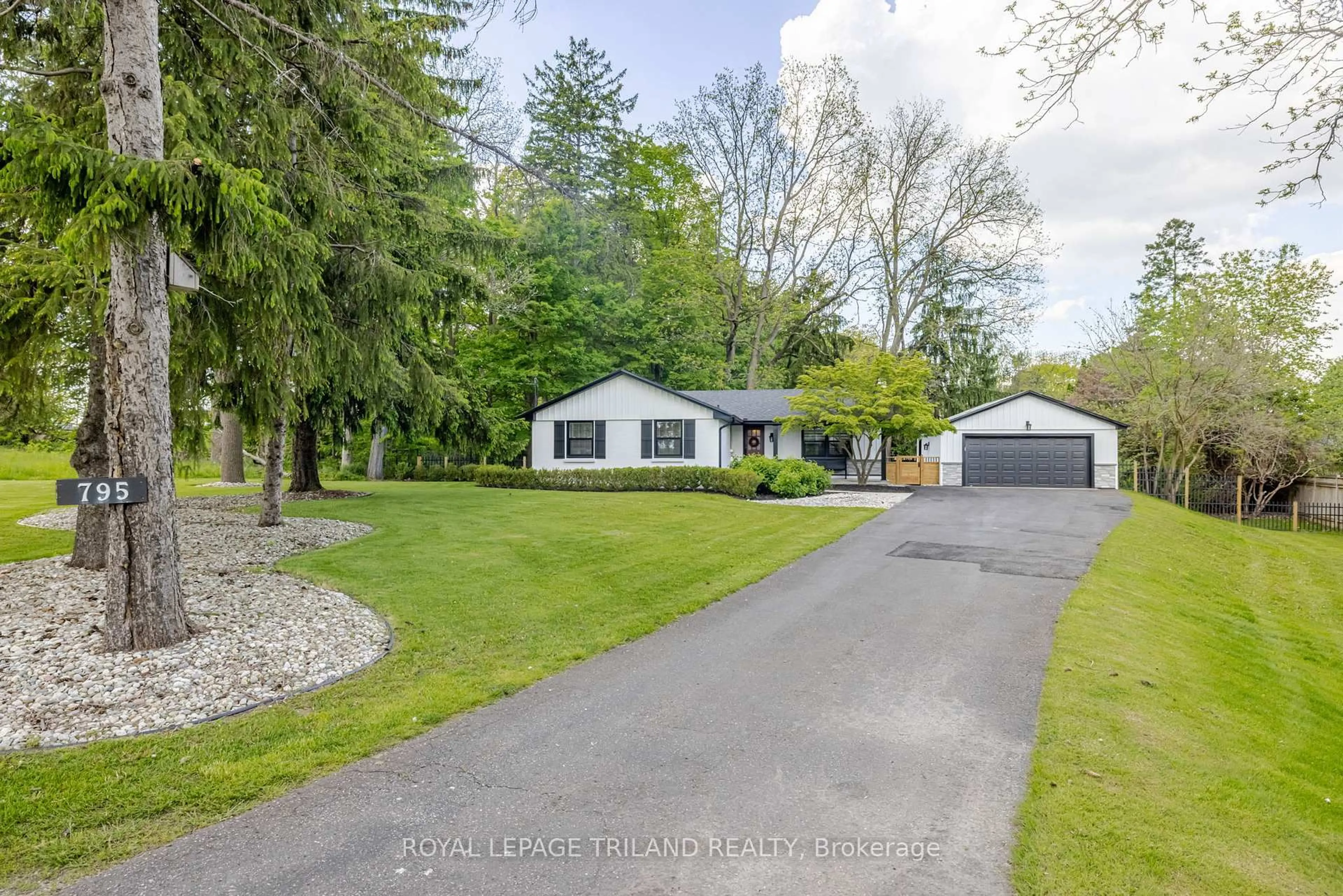 A pic from outside/outdoor area/front of a property/back of a property/a pic from drone, street for 795 Commissioners Rd, London South Ontario N6K 1C1