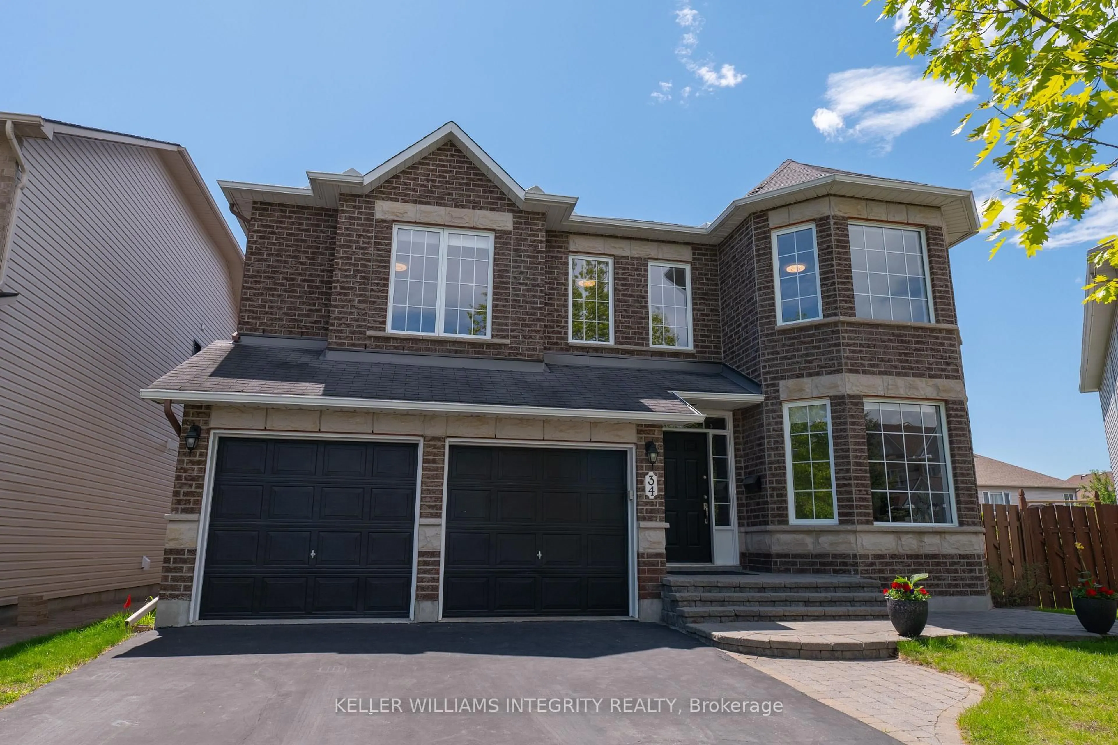 Home with brick exterior material, street for 34 Keighley Circ, Ottawa Ontario K2K 3H8