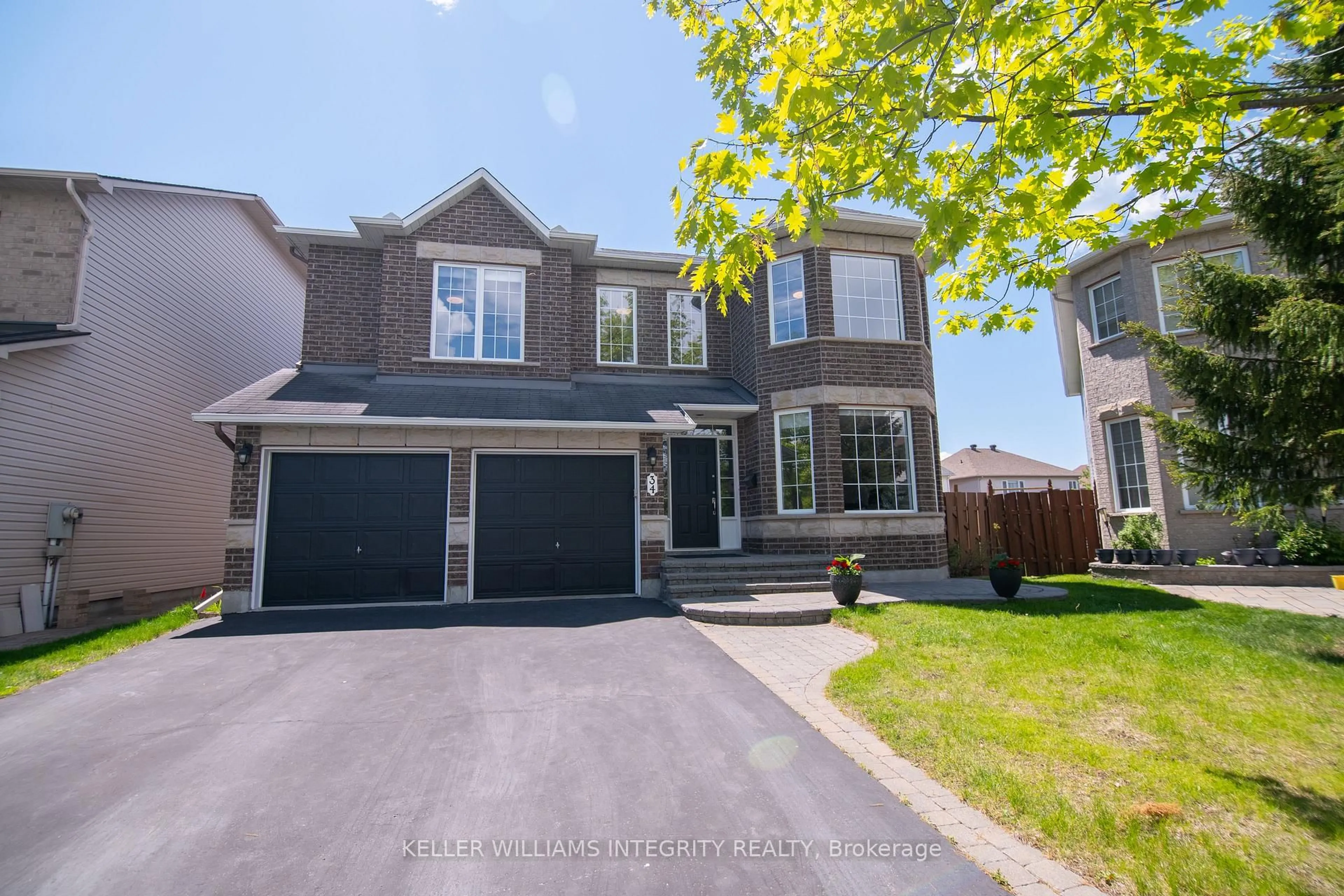 Home with vinyl exterior material, street for 34 Keighley Circ, Ottawa Ontario K2K 3H8