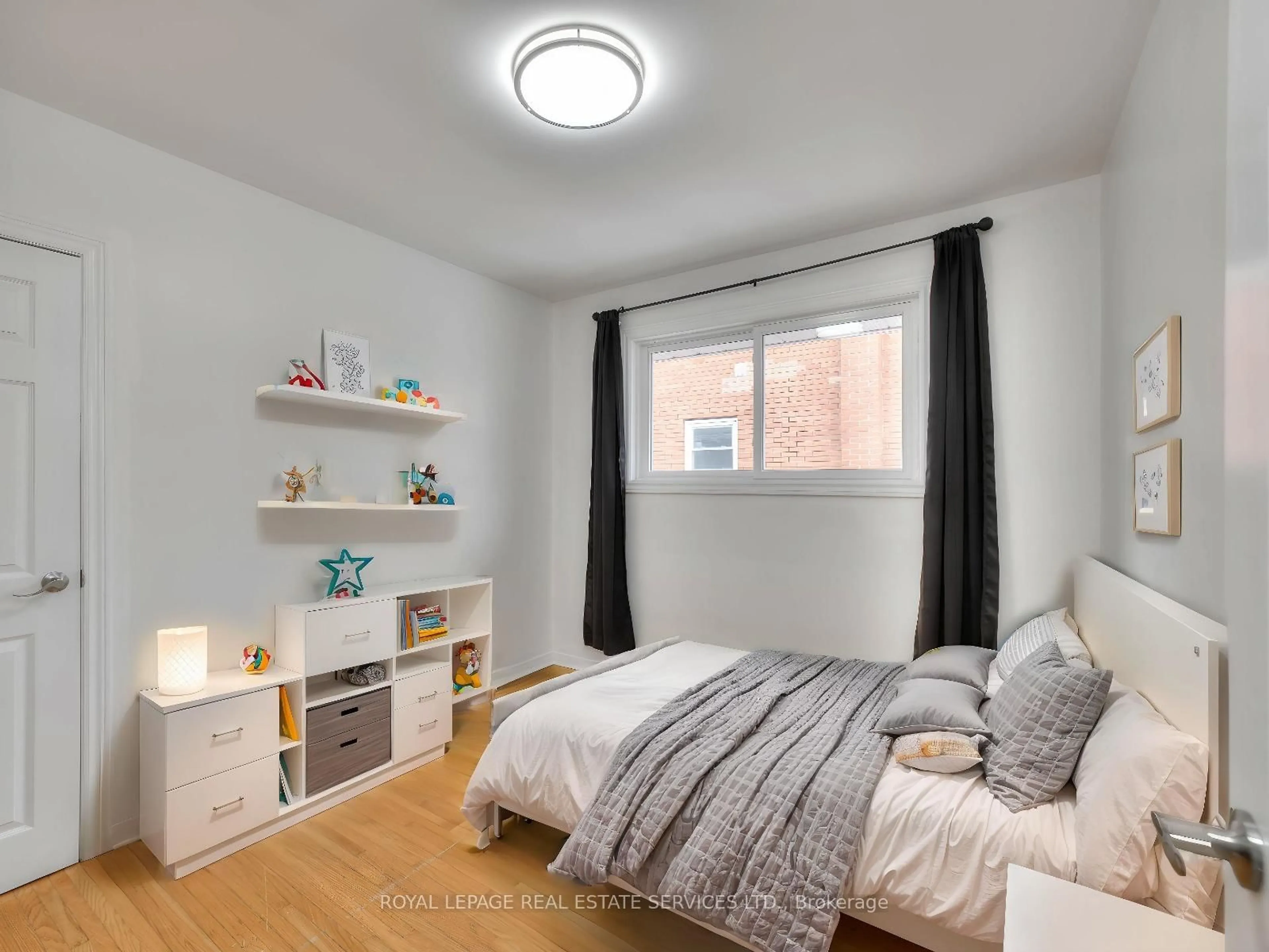 Bedroom with bed, wood/laminate floor for 484 Speedvale Ave, Guelph Ontario N1E 1P2
