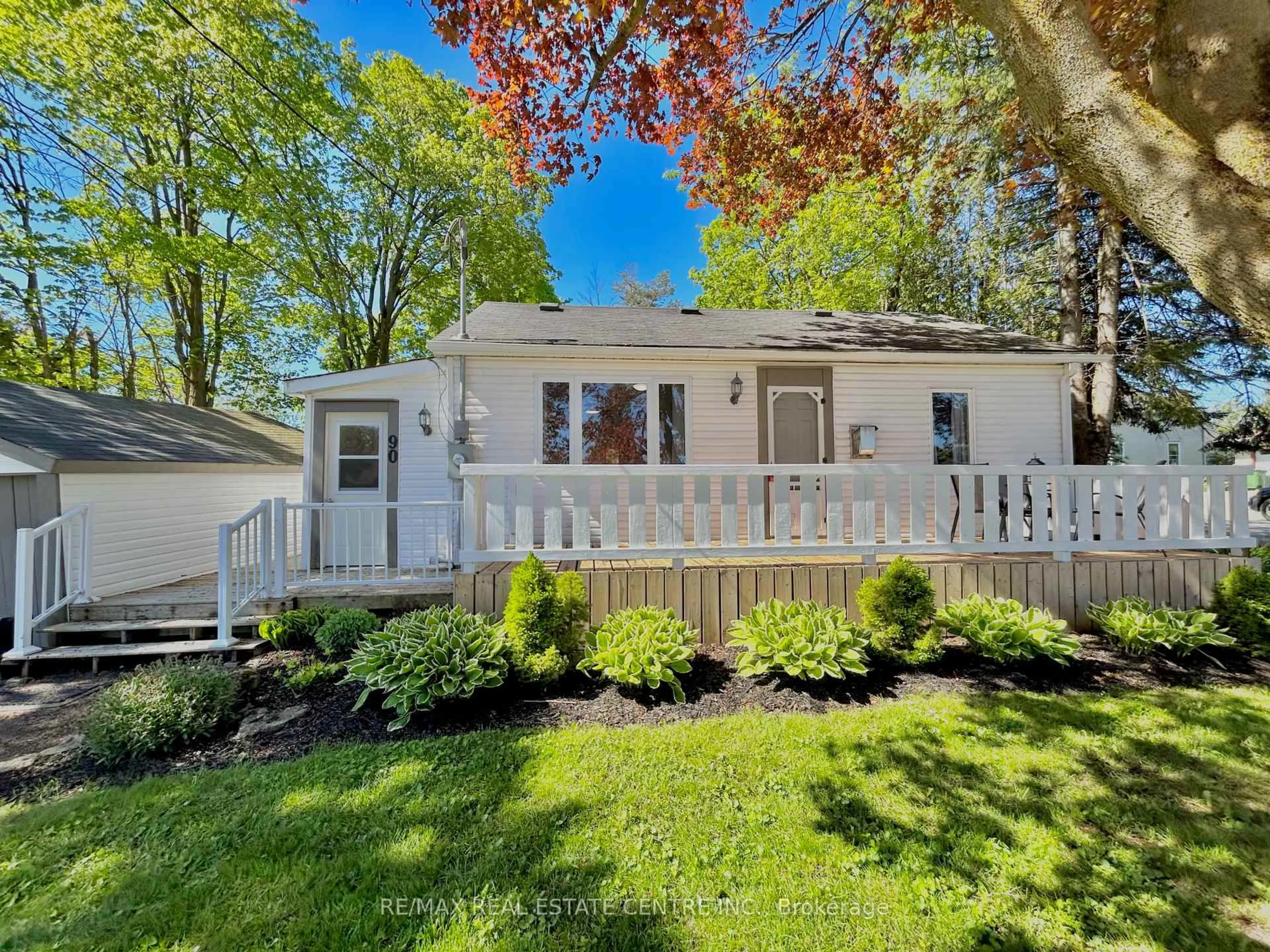 Home with vinyl exterior material, street for 90 Artemesia St, Southgate Ontario N0C 1B0