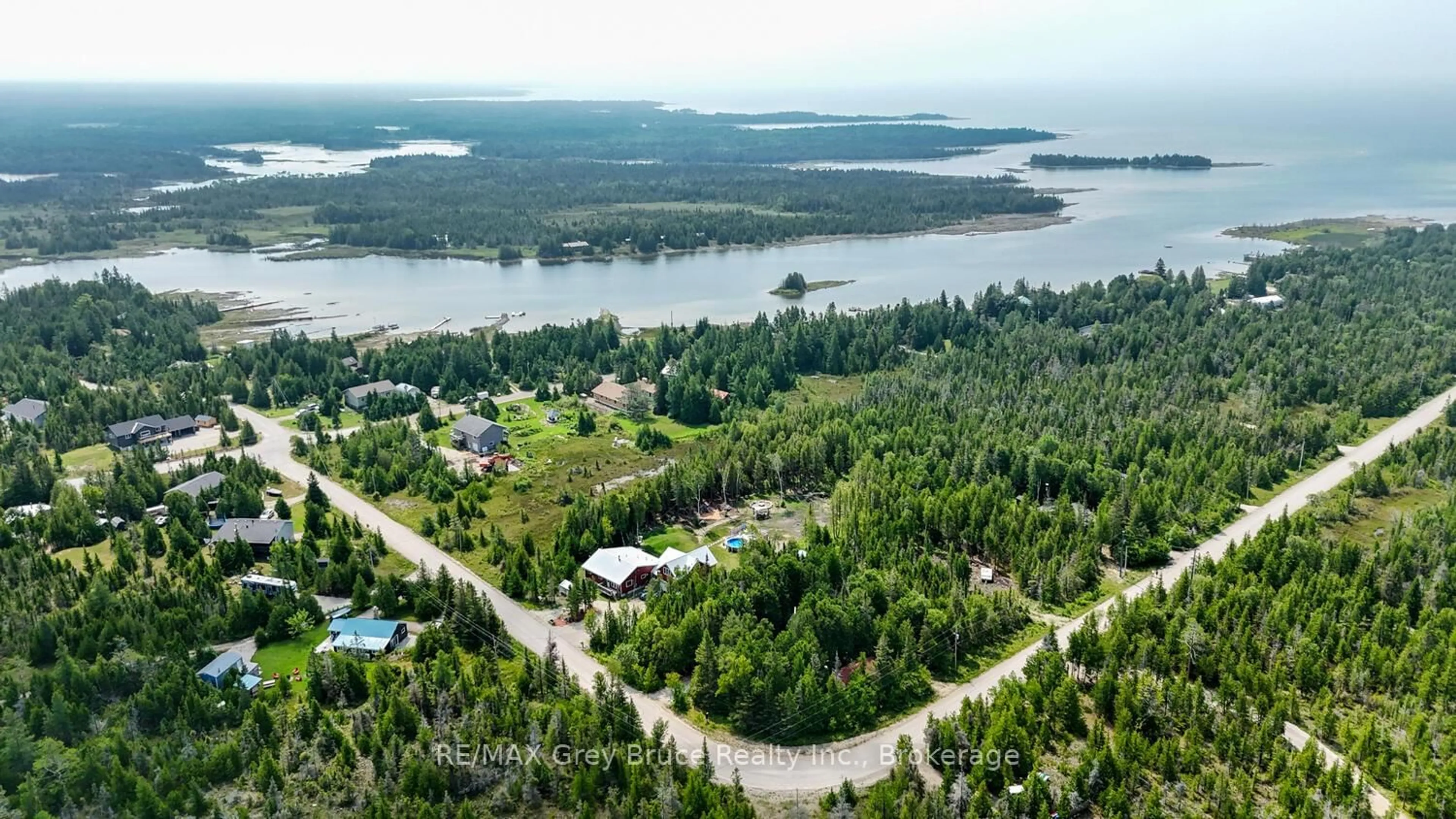 A pic from outside/outdoor area/front of a property/back of a property/a pic from drone, water/lake/river/ocean view for 25 Pine Tree Harbour Rd, Northern Bruce Peninsula Ontario N0H 1Z0