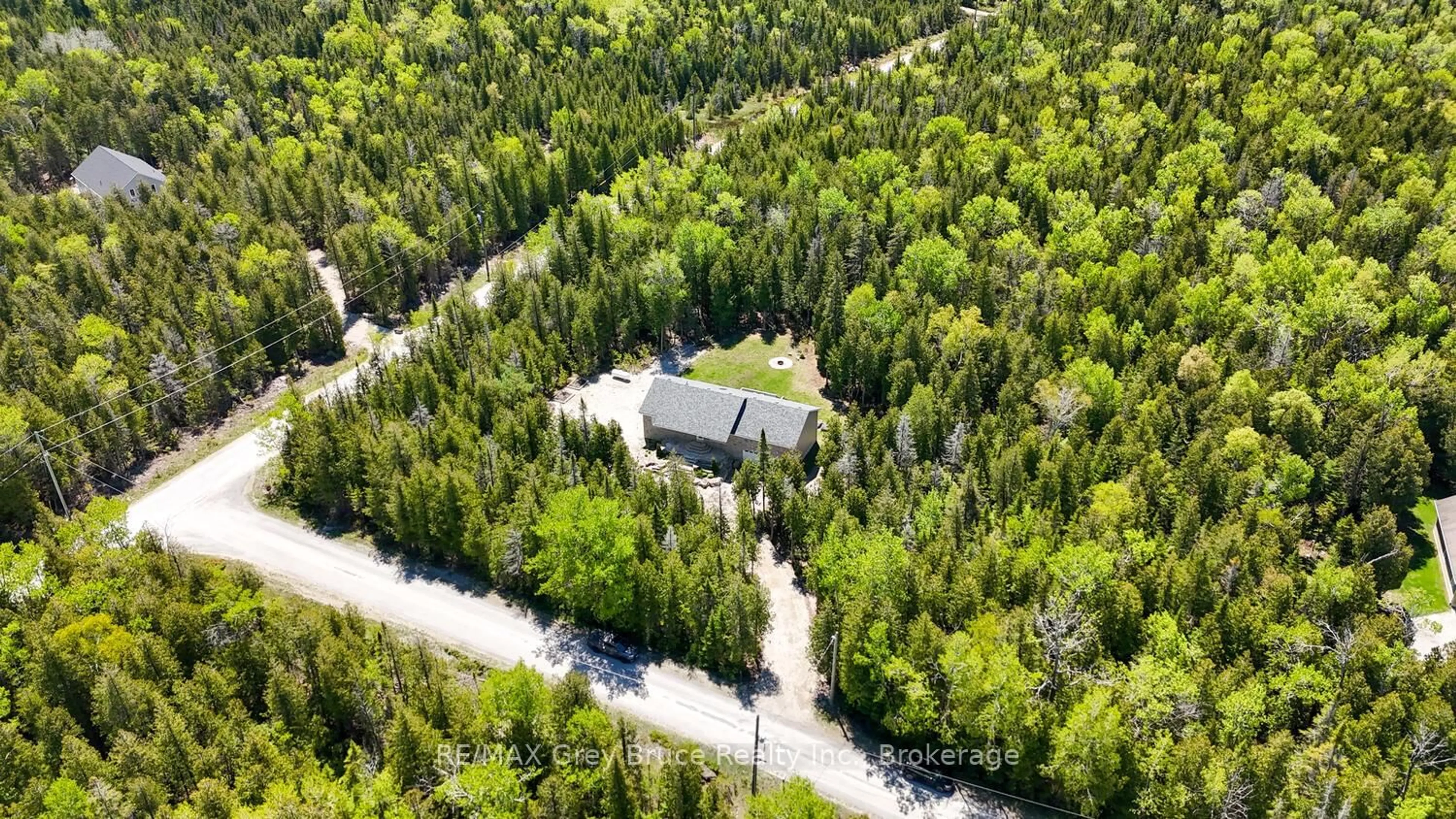 A pic from outside/outdoor area/front of a property/back of a property/a pic from drone, forest/trees view for 114 Pike St, Northern Bruce Peninsula Ontario N0H 1W0