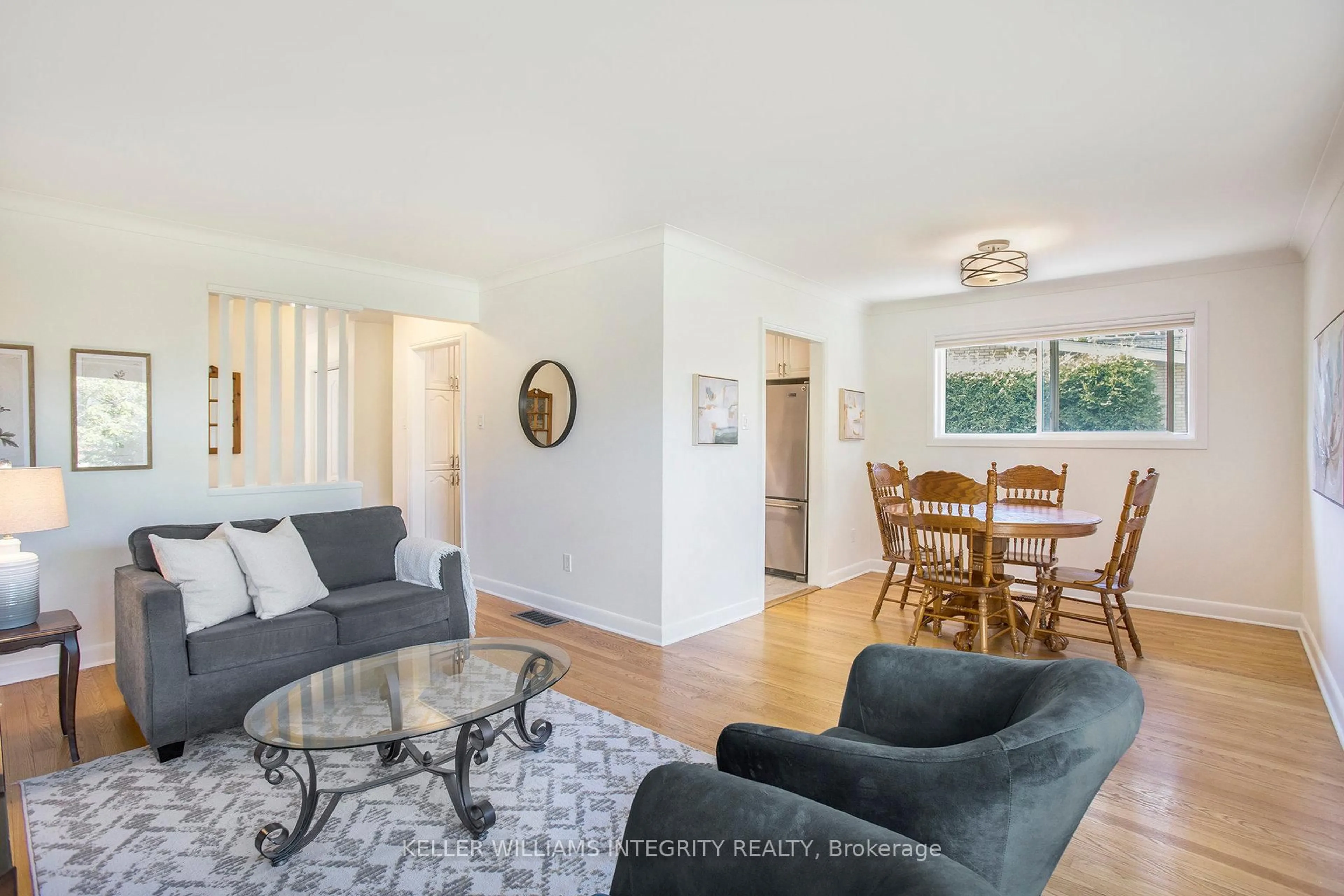 Living room with furniture, wood/laminate floor for 1315 Agincourt Rd, Ottawa Ontario K2C 2J3