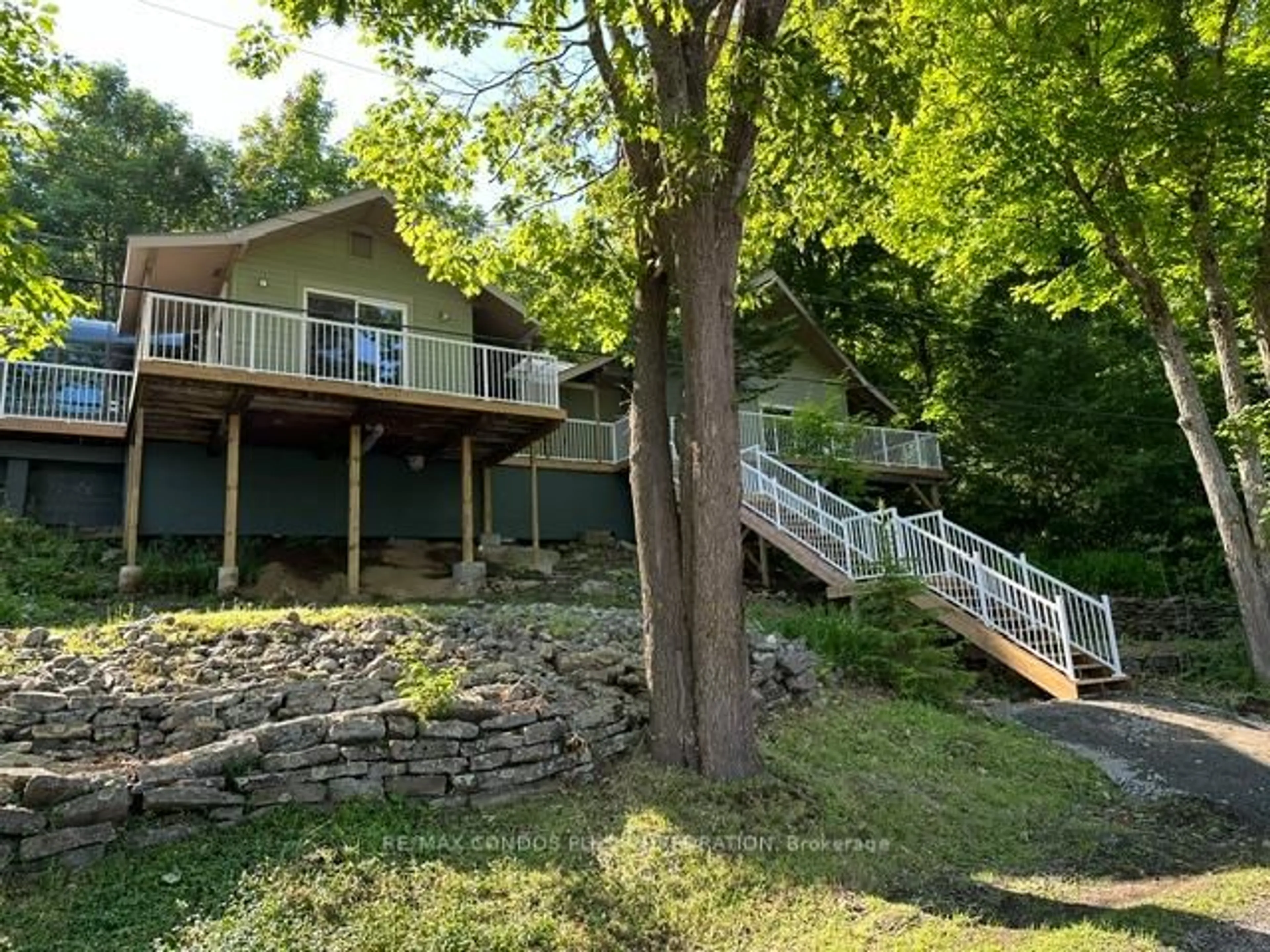 A pic from outside/outdoor area/front of a property/back of a property/a pic from drone, water/lake/river/ocean view for 2341 Brady Lake Rd, Minden Hills Ontario K0M 2K0