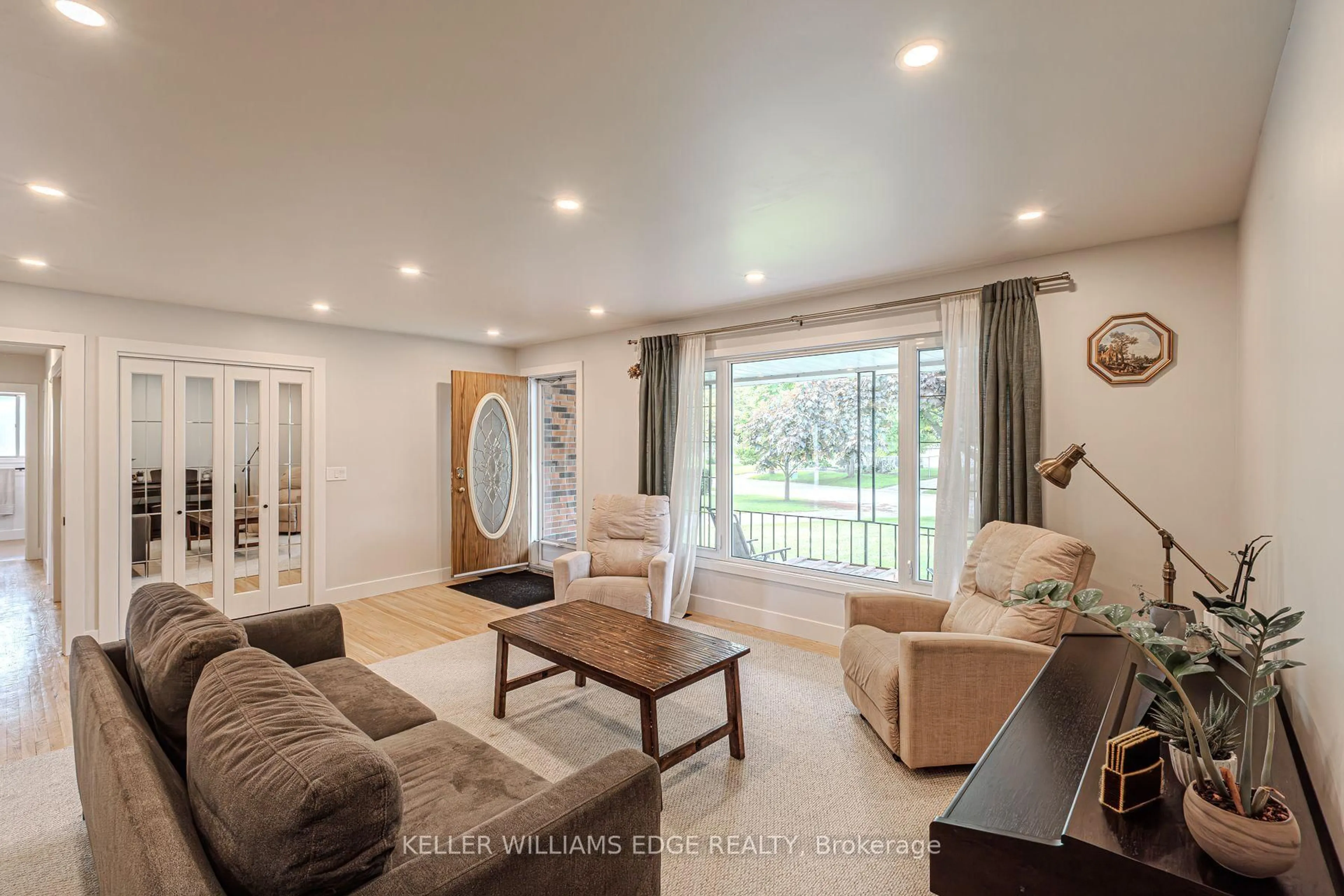 Living room with furniture, wood/laminate floor for 8 Robroy Crt, Brantford Ontario N3R 3E3