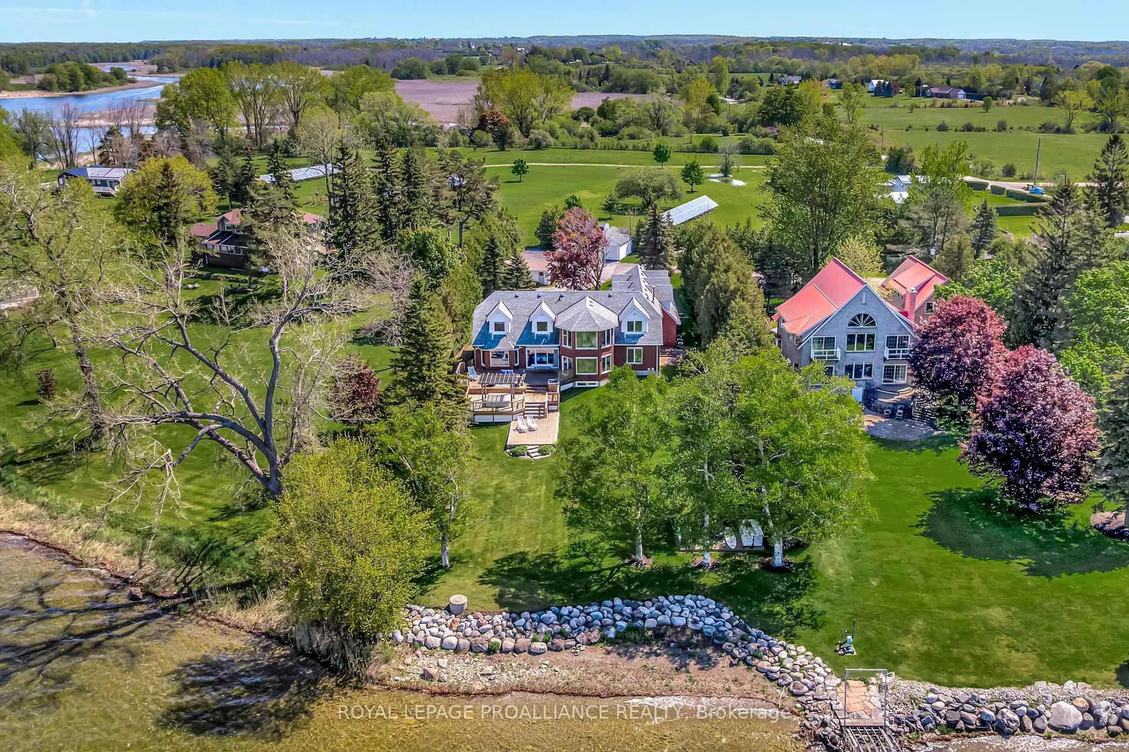 A pic from outside/outdoor area/front of a property/back of a property/a pic from drone, water/lake/river/ocean view for 23 Quigg Lane, Prince Edward County Ontario K0K 1L0