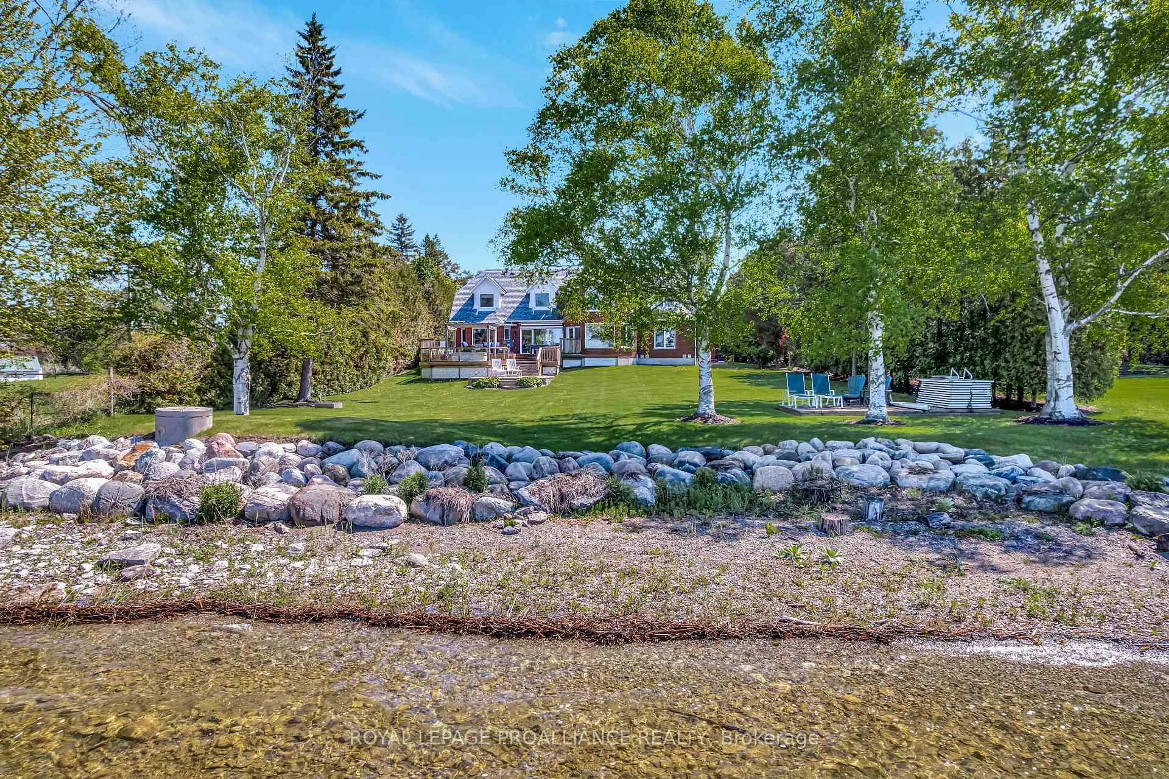 A pic from outside/outdoor area/front of a property/back of a property/a pic from drone, water/lake/river/ocean view for 23 Quigg Lane, Prince Edward County Ontario K0K 1L0