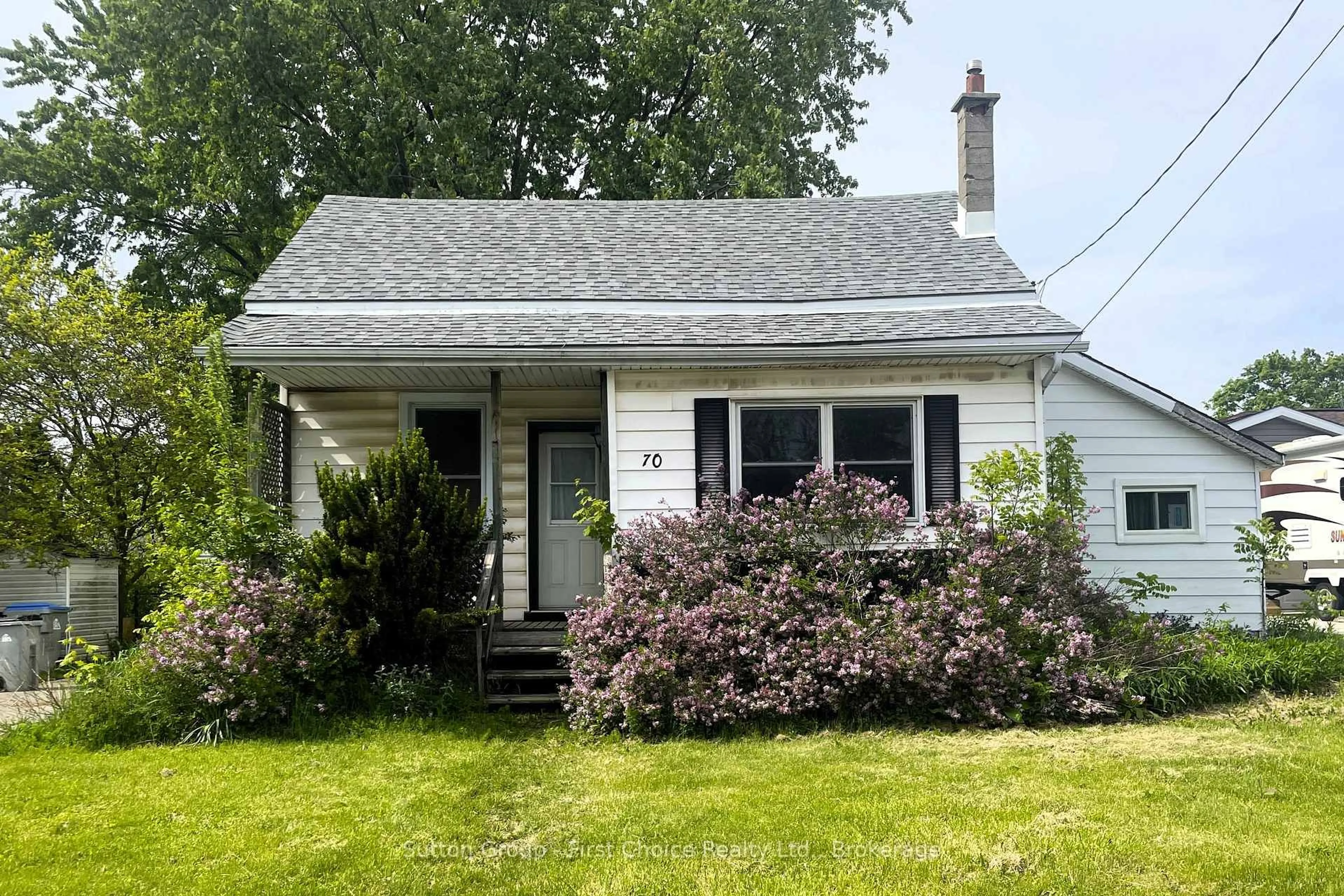 Home with vinyl exterior material, street for 70 Queen St, Bluewater Ontario N0M 1X0