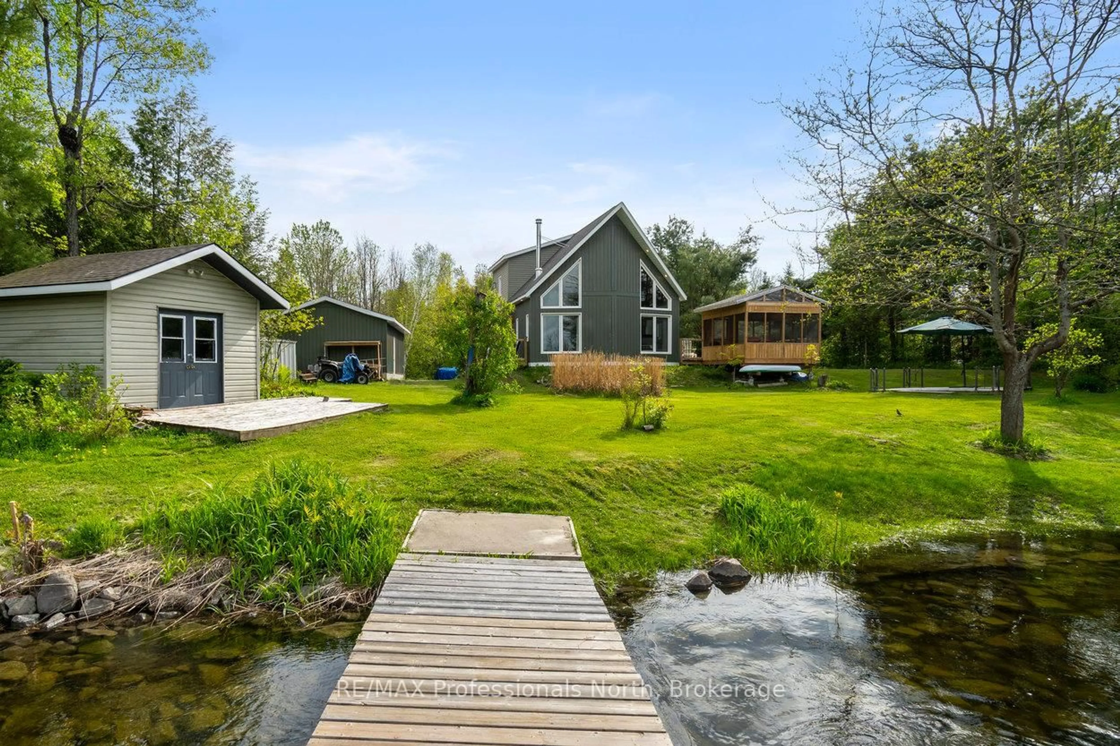 A pic from outside/outdoor area/front of a property/back of a property/a pic from drone, water/lake/river/ocean view for 1059 Tiffany Lane, Minden Hills Ontario K0M 2K0