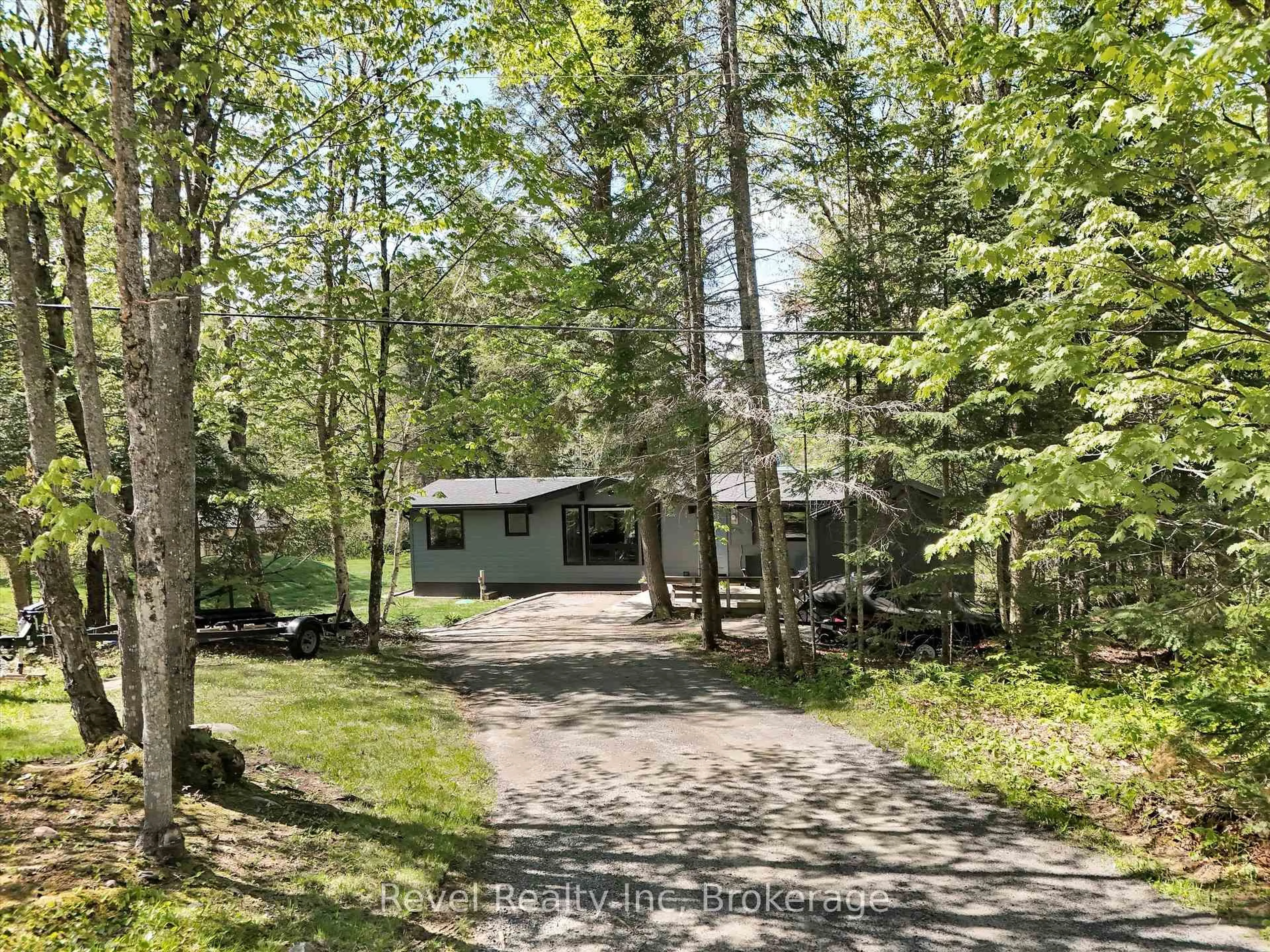 A pic from outside/outdoor area/front of a property/back of a property/a pic from drone, forest/trees view for 205 Ena Dr, Huntsville Ontario P1H 2J4