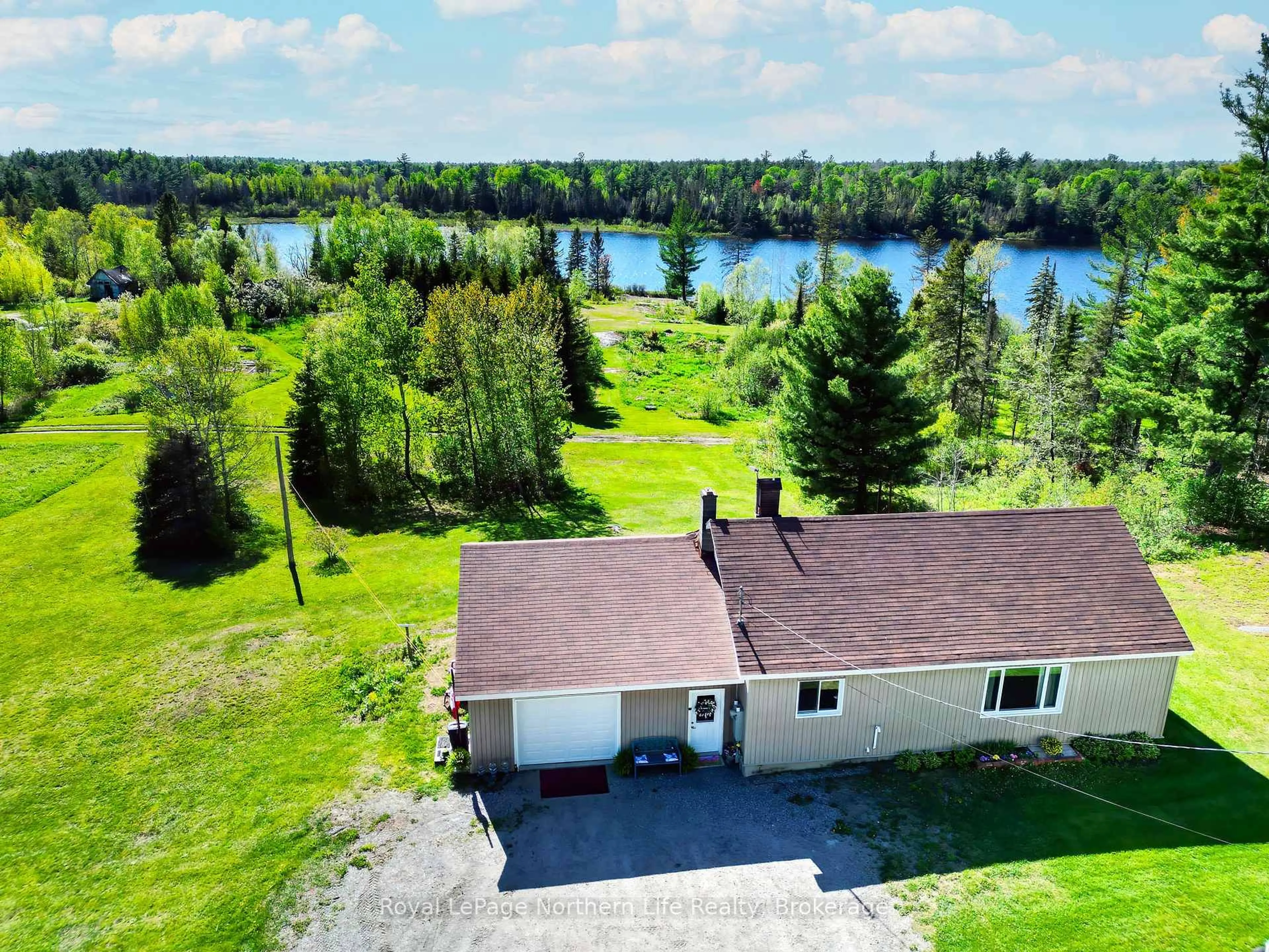 A pic from outside/outdoor area/front of a property/back of a property/a pic from drone, water/lake/river/ocean view for 81 Bear Lake Rd, West Nipissing Ontario P0H 2M0