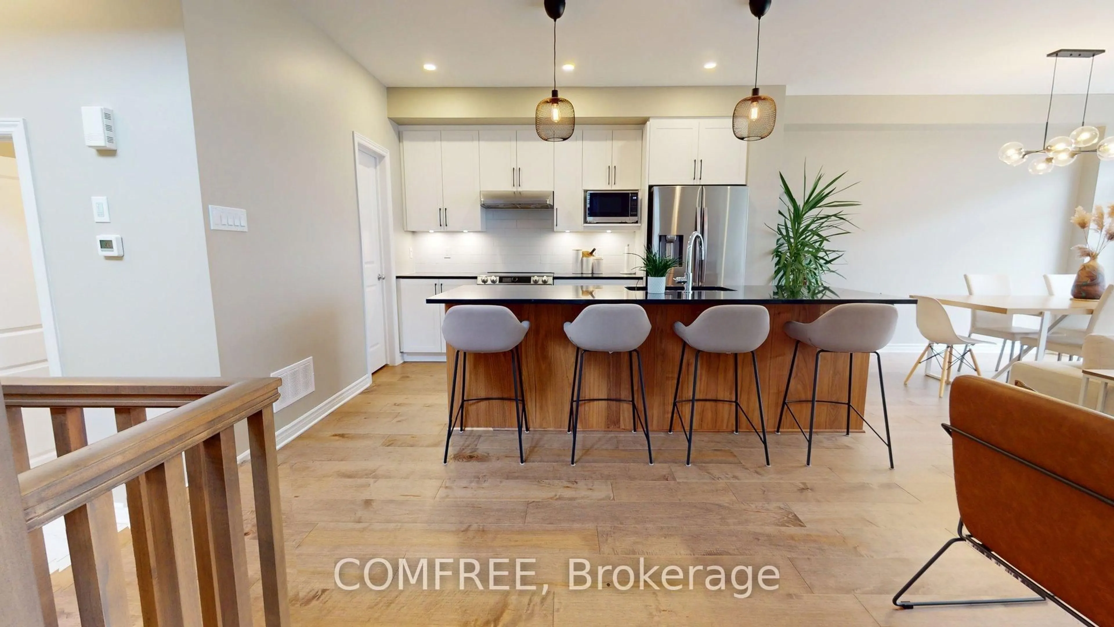 Open concept kitchen, wood/laminate floor for 515 Sonmarg Cres, Ottawa Ontario K2J 7A6