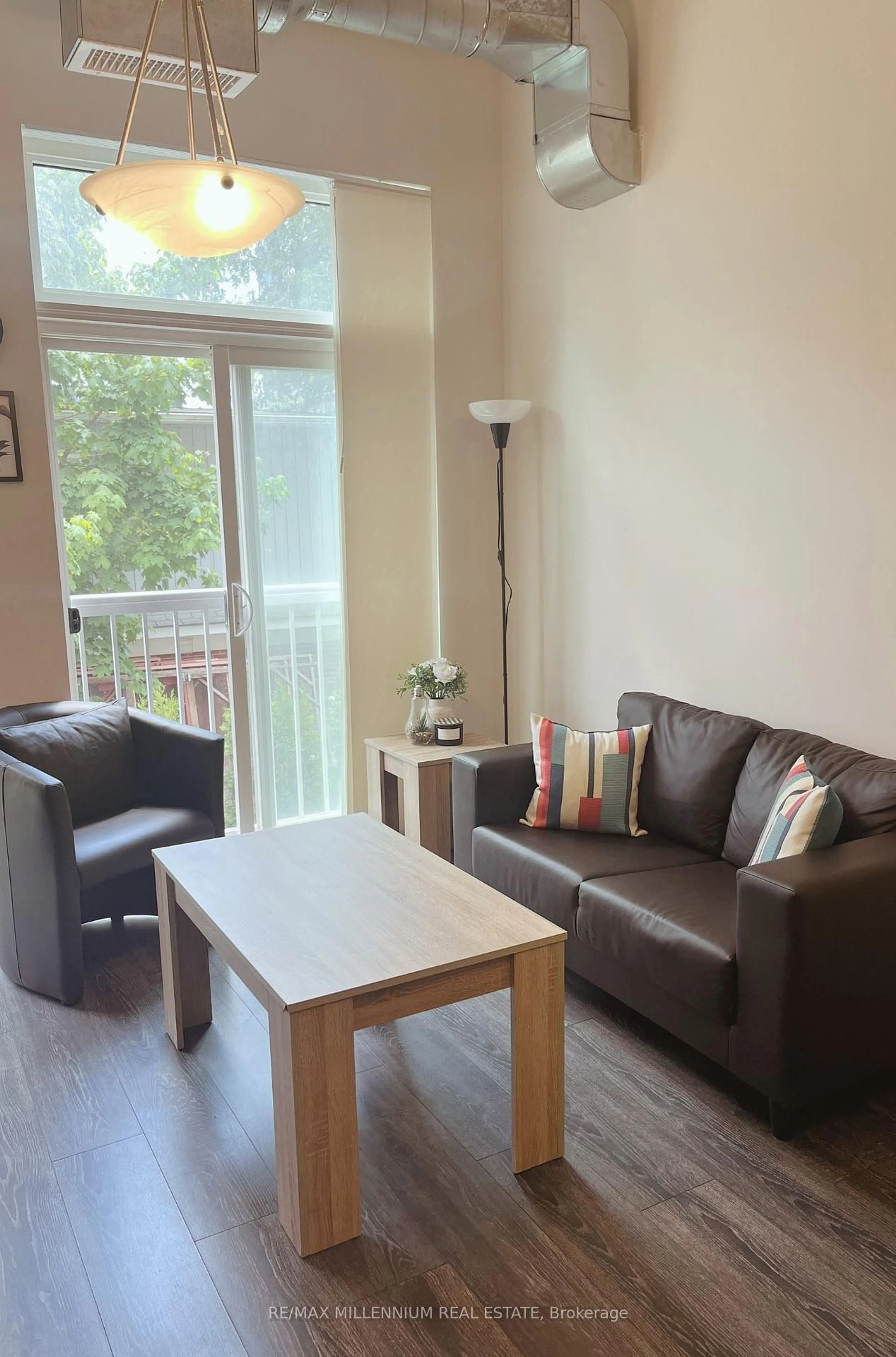 Living room with furniture, wood/laminate floor for 253 Albert St #202, Waterloo Ontario N2L 0G3