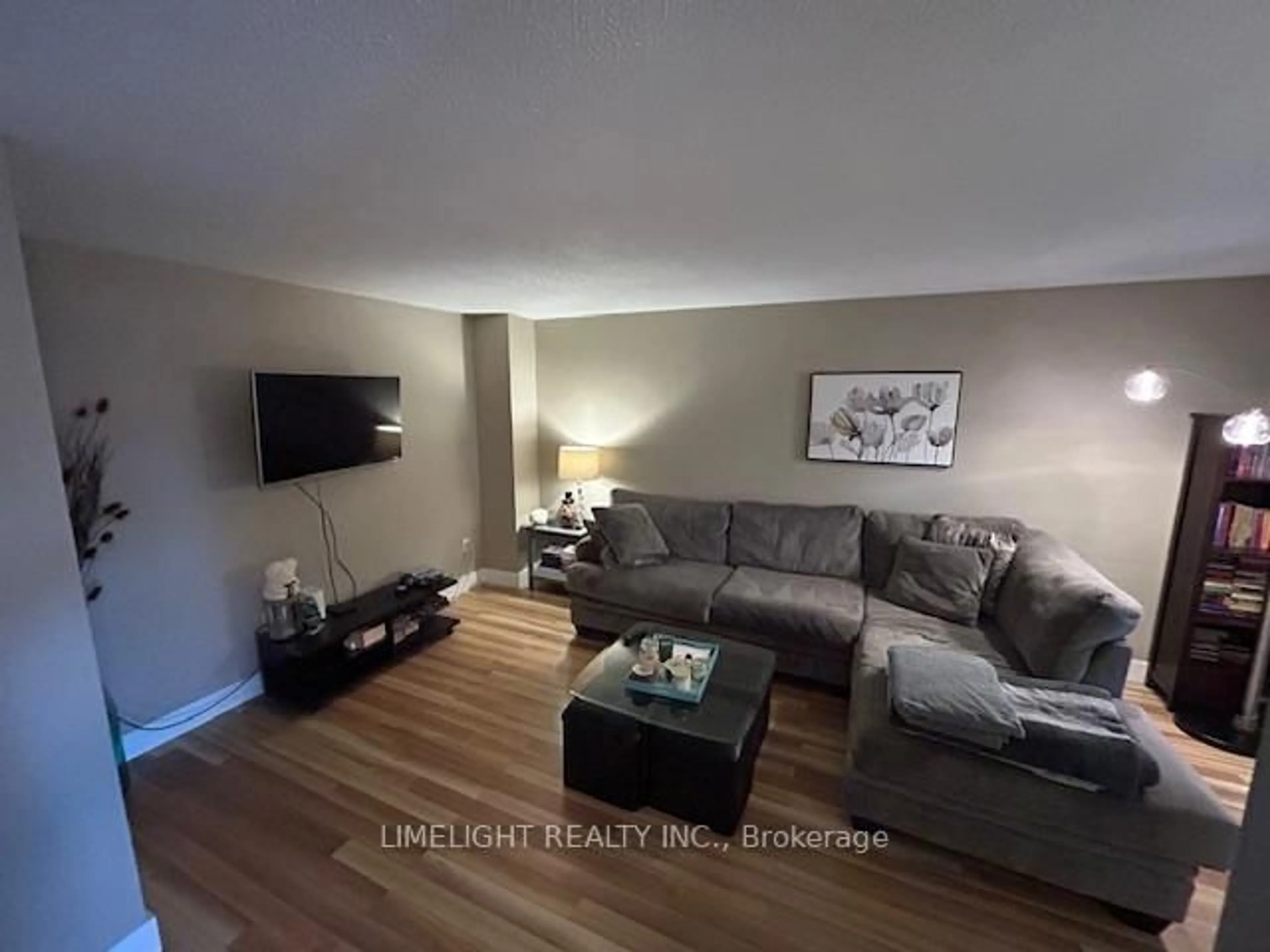 Living room with furniture, wood/laminate floor for 71 Erica Cres, London South Ontario N6E 3P5
